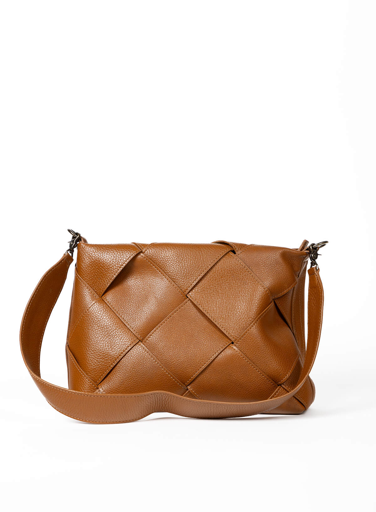 Honey woven leather handbag on a white background