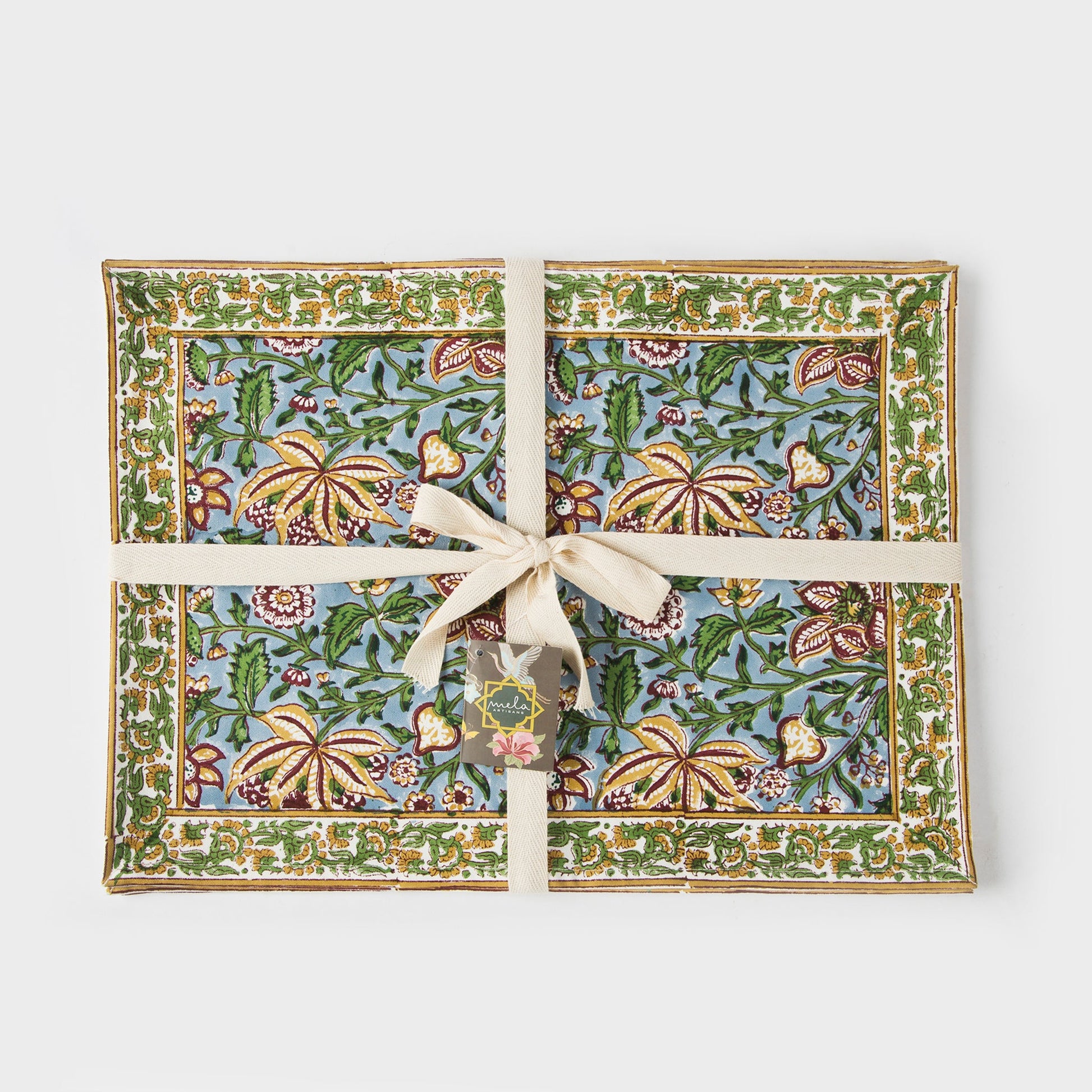 A dining table setting featuring the set of four placemats