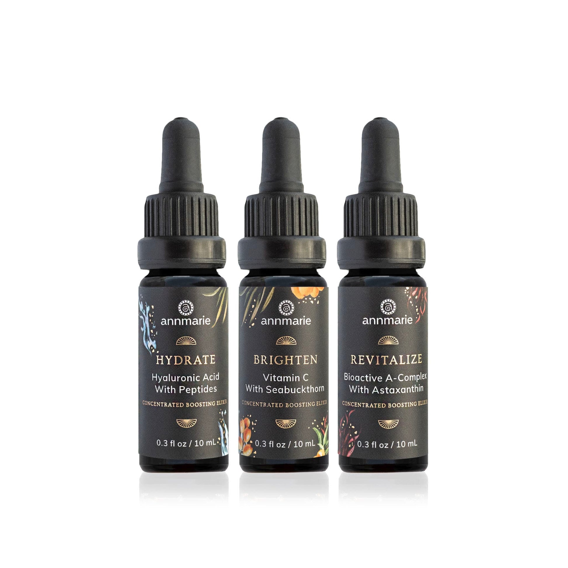 Three concentrated boosting elixirs—Hydrate with hyaluronic acid and peptides, Brighten with vitamin C and seabuckthorn, and Revitalize with bioactive A-complex and astaxanthin—in small dropper bottles on a white background.
