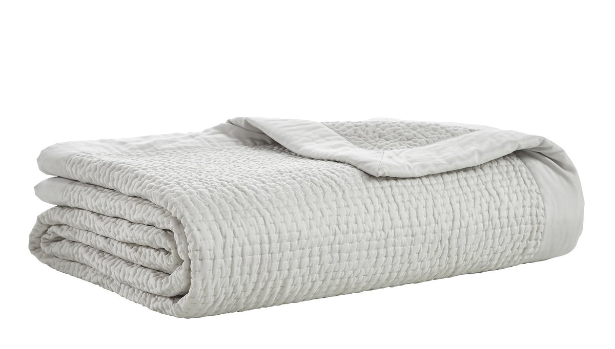 CL-197-9496_5|Folded light grey coverlet featuring a subtle waffle-knit texture, offering a cozy and stylish addition to modern bedroom decor.
