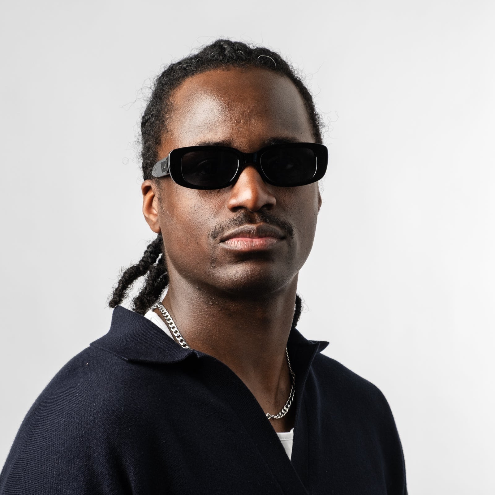Male wearing Sad Eyewear Bouquet rectangle sunglasses in gloss black with black tinted lenses