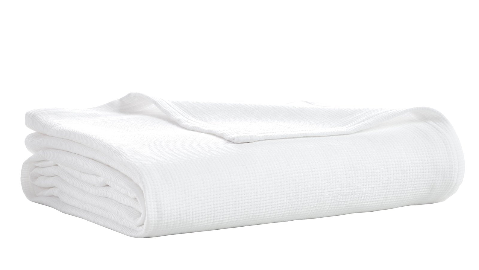 BL-858-9496_6|Neatly folded crisp white woven blanket, showcasing its soft texture, perfect for adding comfort and style to any home decor.