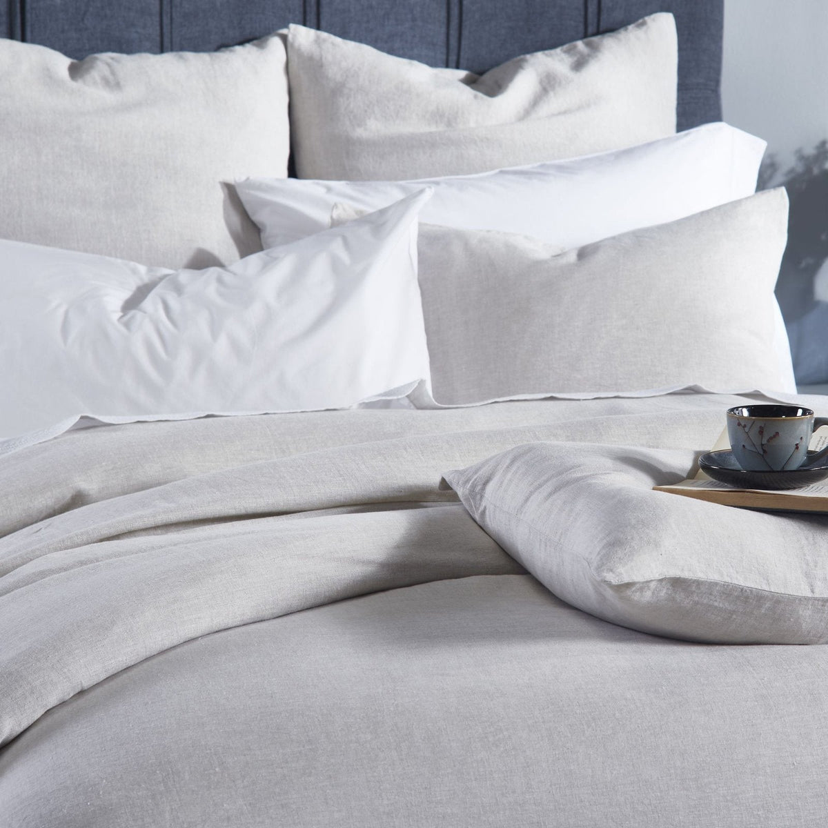 DT-038-10692_1|Relaxed natural linen duvet cover in light grey, enhancing a calm, modern bedroom. Comfortable, breathable, chic style.