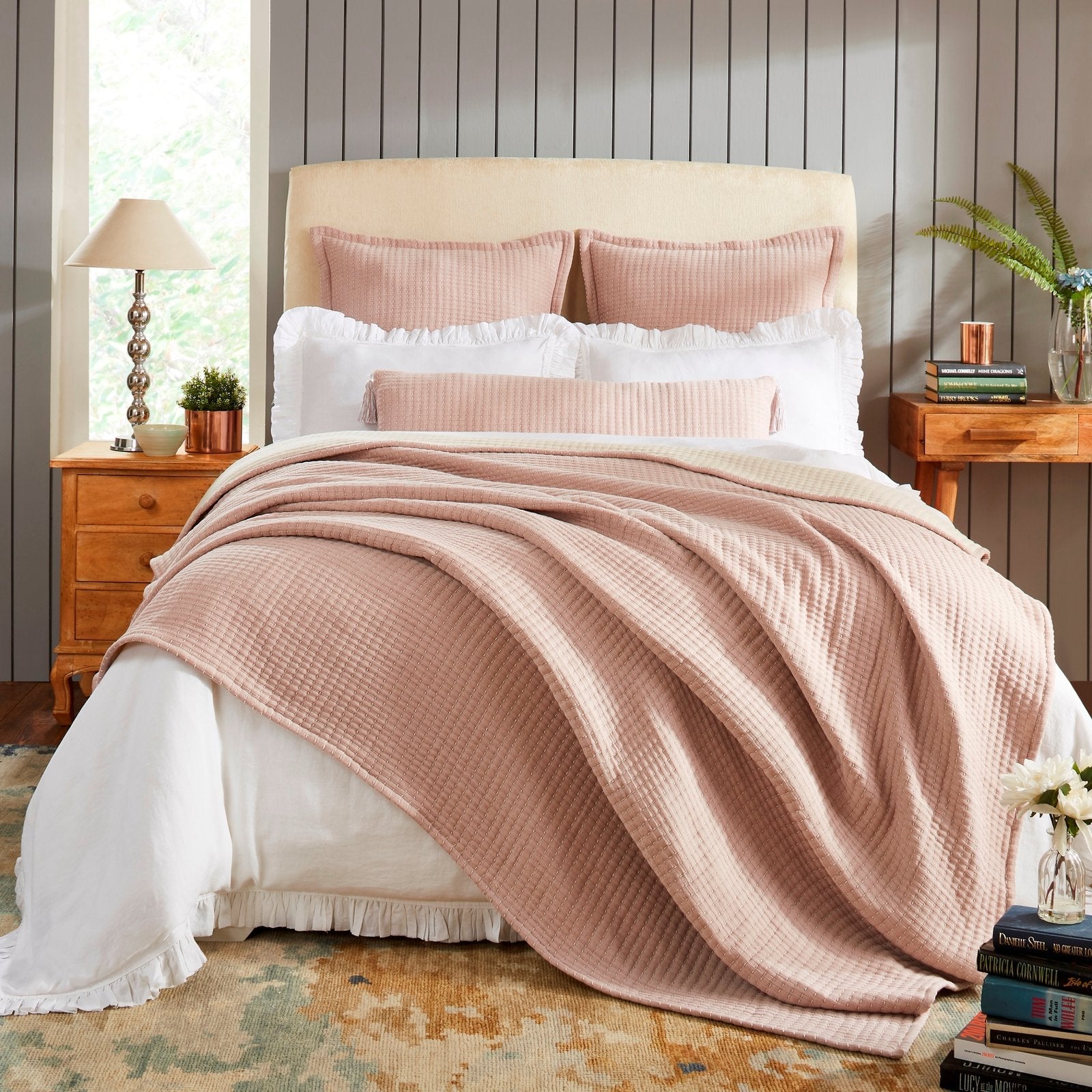 BT-105-11096_1|Beautiful blush pink textured blanket elegantly draped over a bed, offering soft comfort and a chic touch to bedroom style.