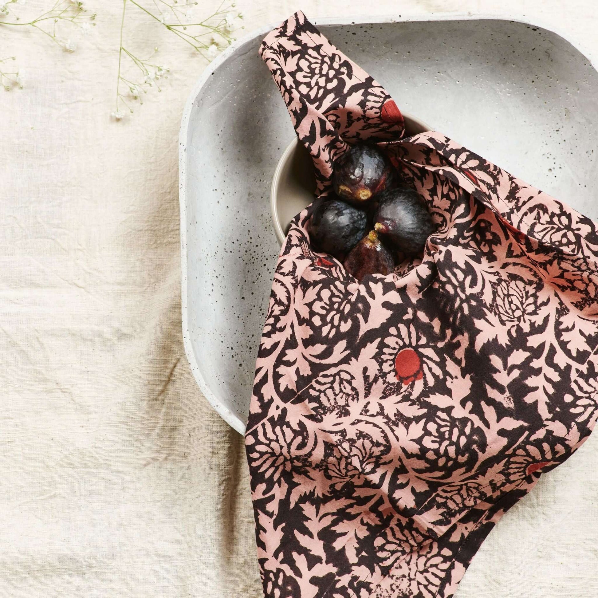 Hummus Floral Wax Block Printe Cotton Table Napkin( set of 4 ) wrapped around a bowl with figs.