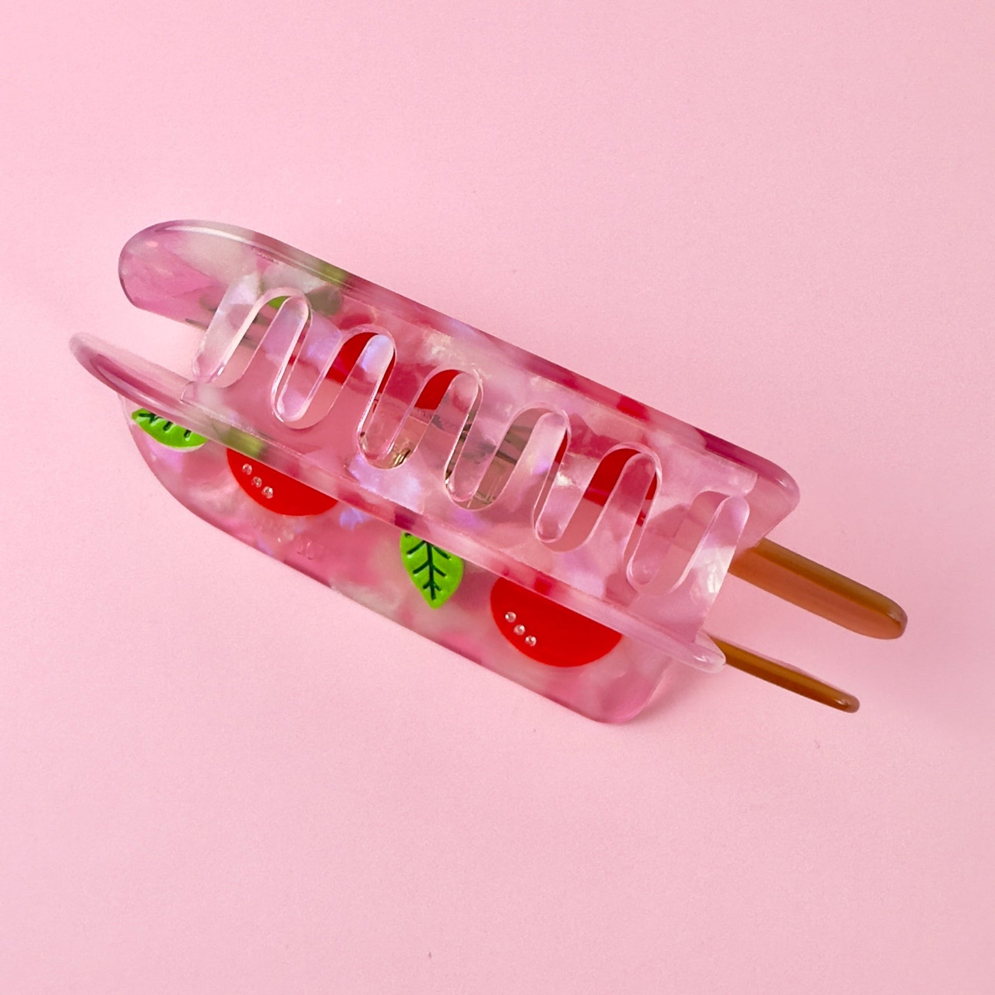 Cherry popsicle hair claw, stay cool with this delicious hair accessory from Centinelle. Handmade on cellulose acetate, with splice technique, exquisite miniature details and crystals, that are tied directly to its value and make them unique and special.  