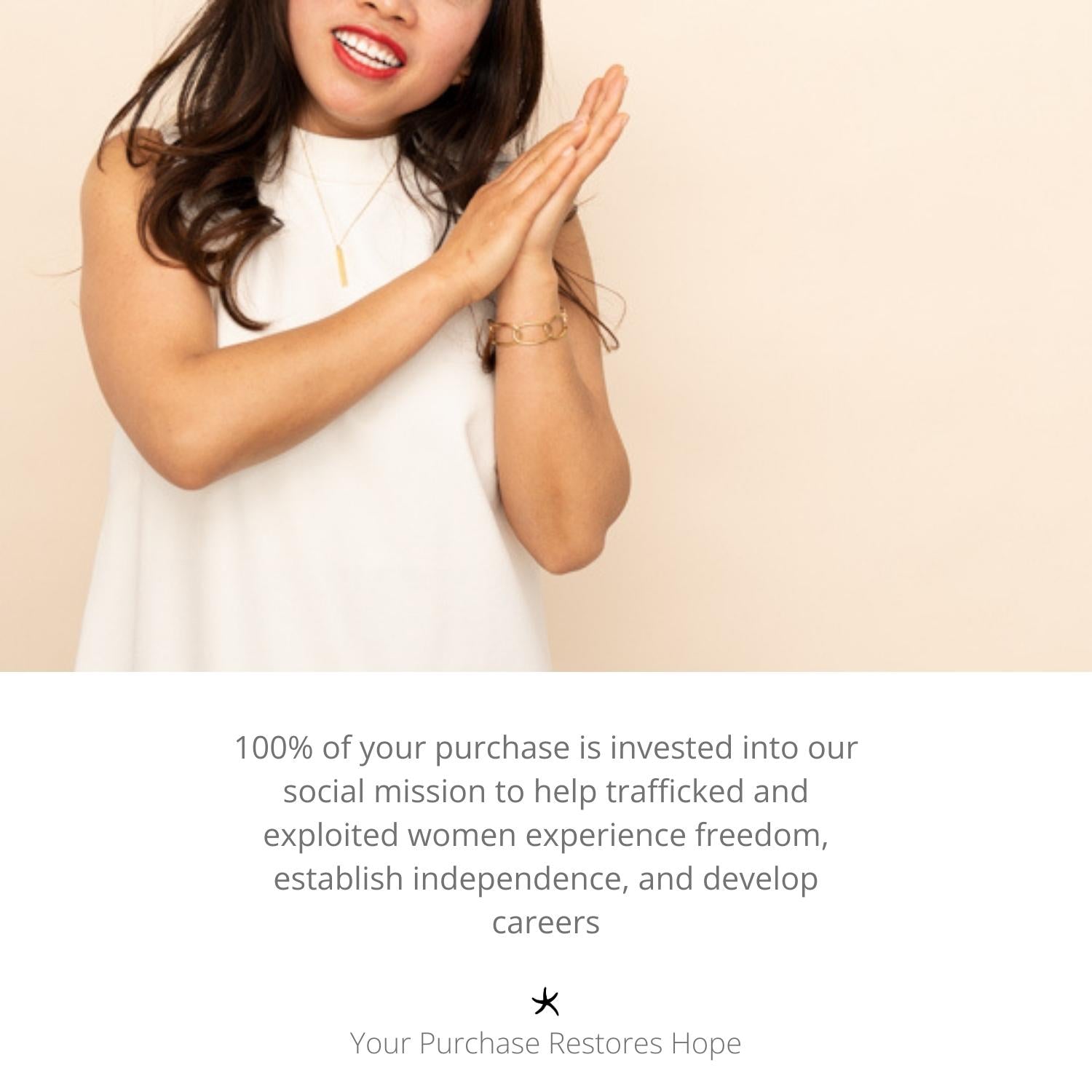 Photo of woman clapping and wearing high quality gold jewelry, golds, women's artisan jewelry, jewelry company, freedom organization