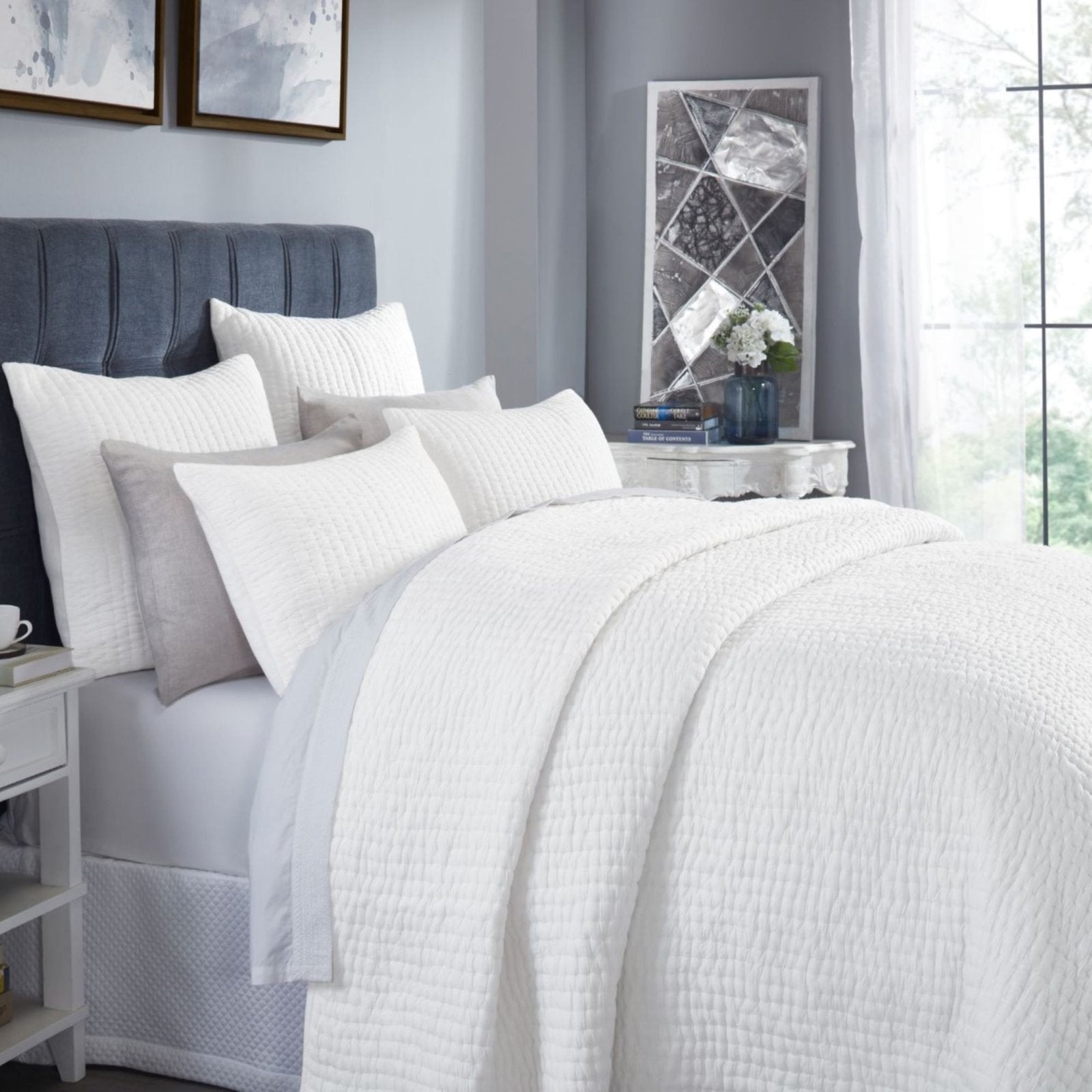 QT-358-9496_3|Crisp white quilted bedding set with subtle textured stripes, neatly arranged on a modern bed for a serene bedroom aesthetic.