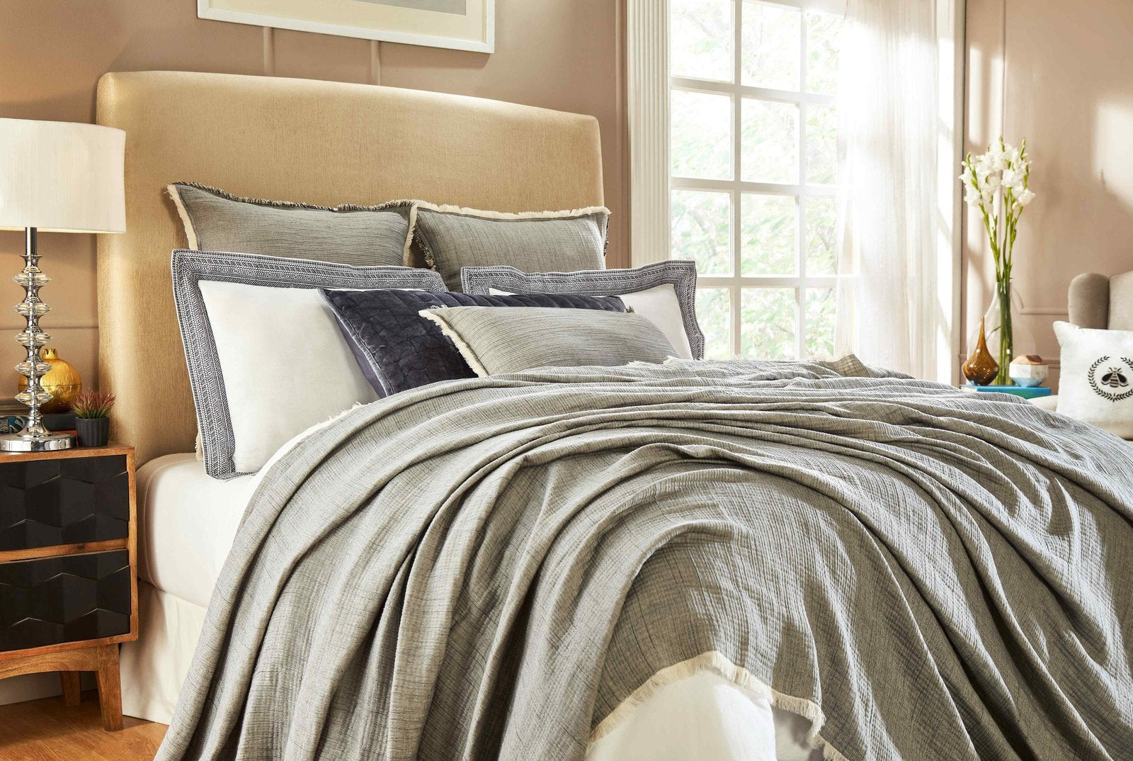 BT-104-9496_1|Luxurious gray fringed blanket on a styled bed, adding cozy warmth and modern elegance to any bedroom decor.