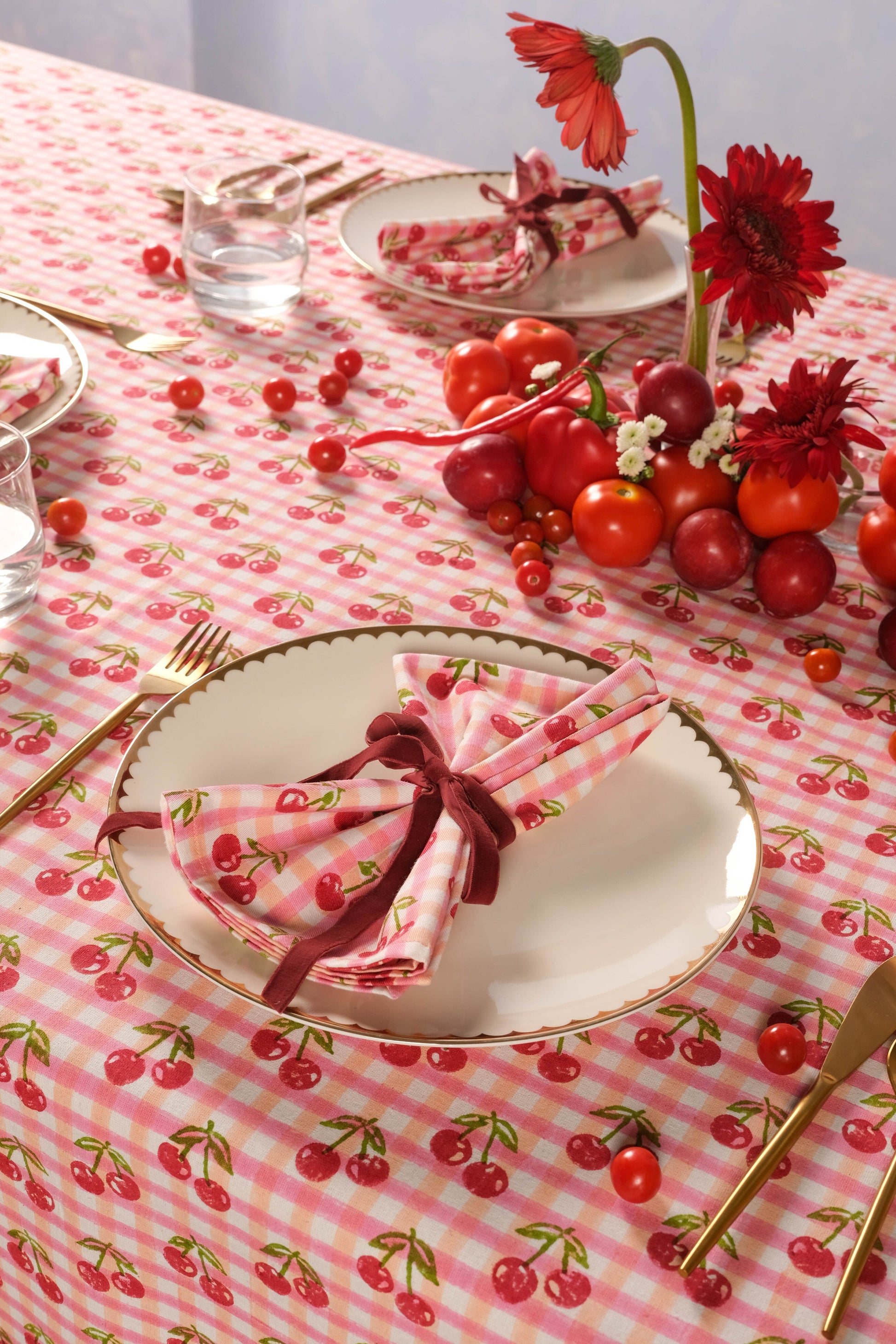 Red gingham cherry blockprint tablecloth with dining setup