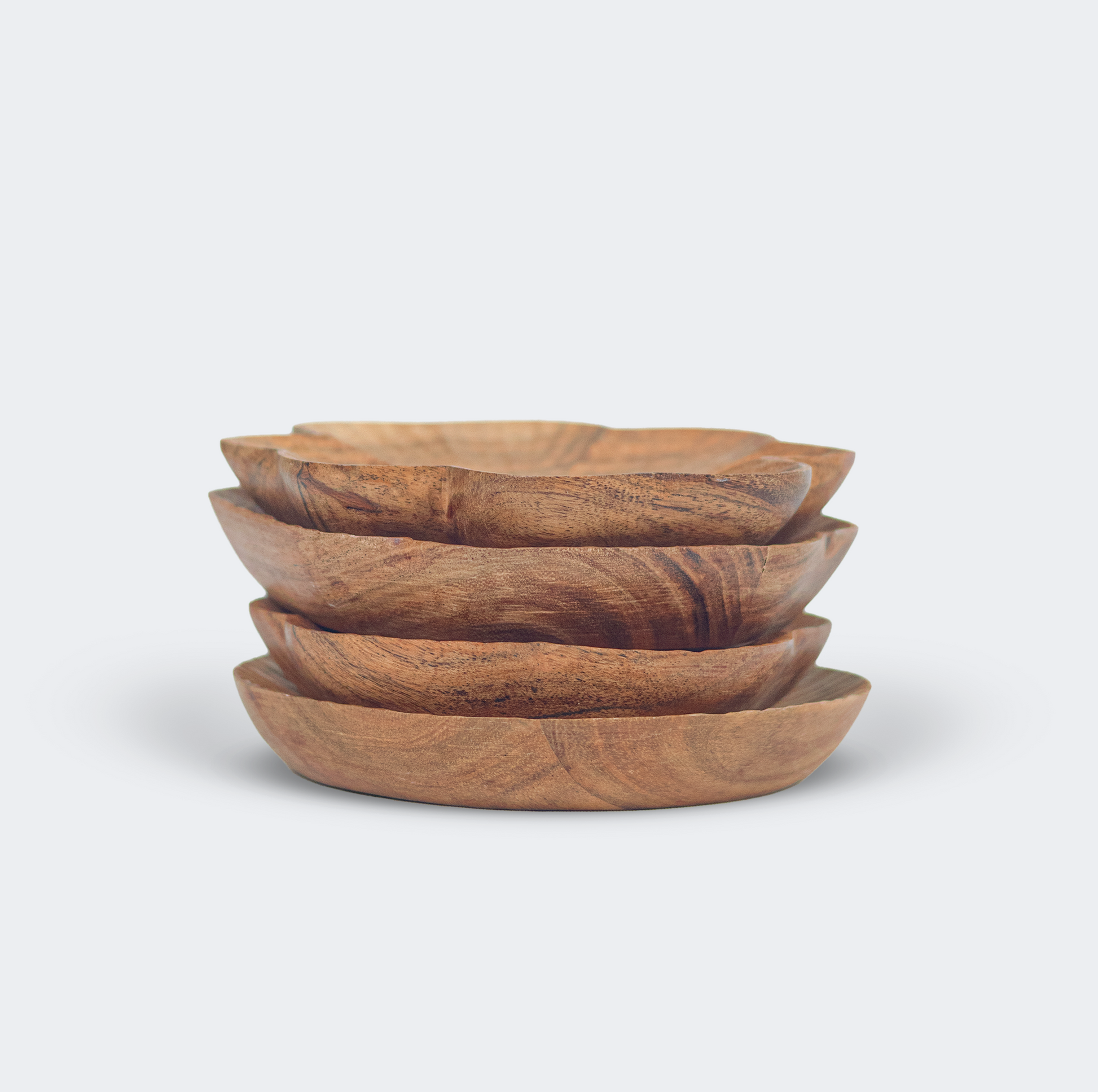 Close-up of hand-carved wood texture and natural grain on trinket tray