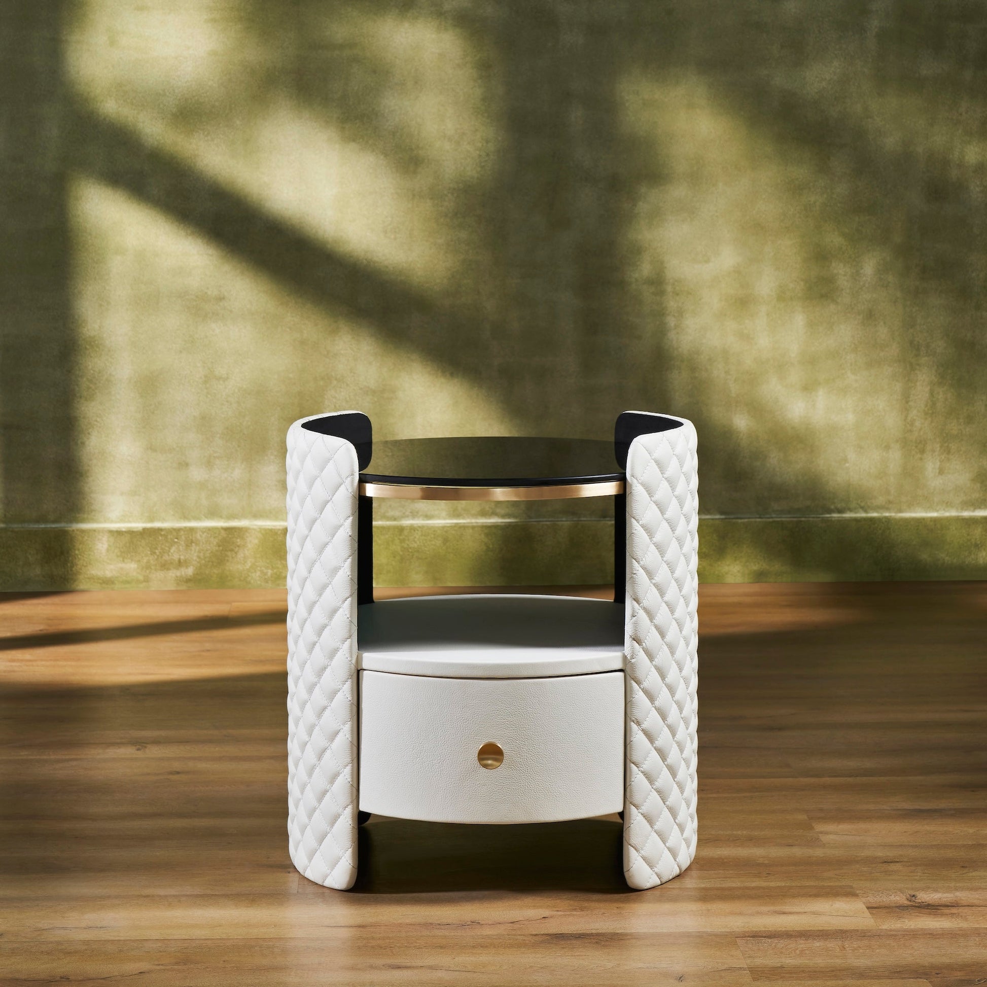 FN-5214-202022_1|White leather nightstand featuring diamond-quilted curved sides, a round black glass top, and one drawer with a gold-toned knob.