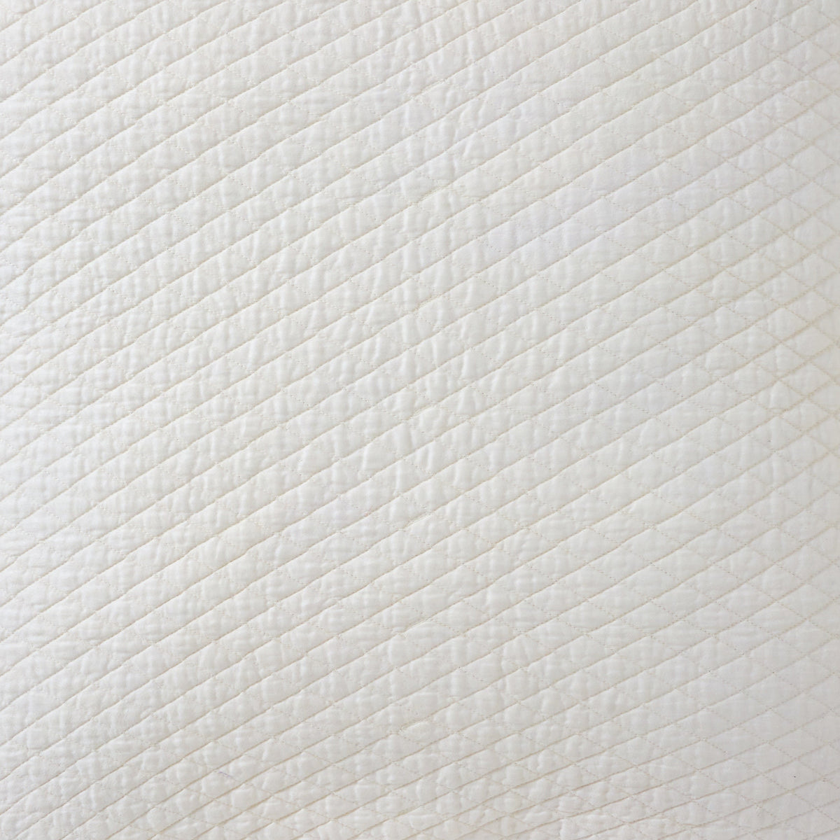 CL-265-11096_9|Close-up of an elegant white diamond quilted coverlet, showcasing its intricate texture. Premium, soft bedding for luxurious comfort.