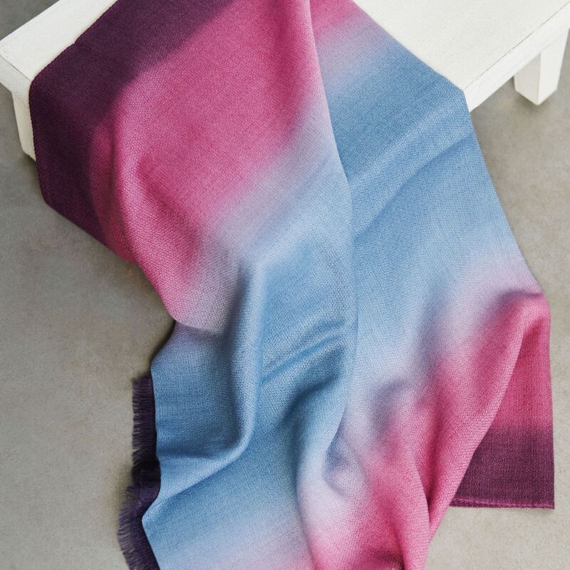 Iris Haze Blue Pink Cashmere Merino Handloom Scarf draped elegantly on a table, showcasing soft blended colors.