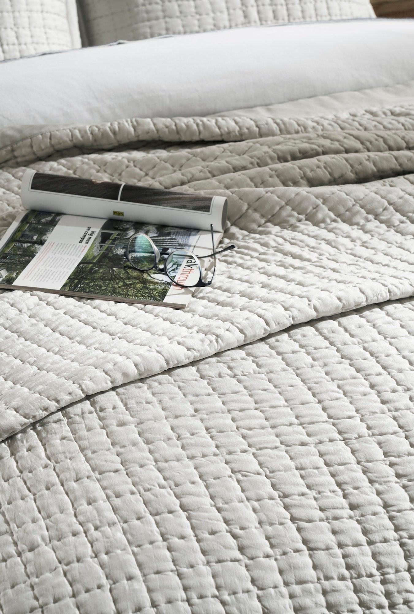 CL-198-9496_4|Detailed view of a grey quilted coverlet showcasing its textured grid pattern. Ideal for modern and classic beds.