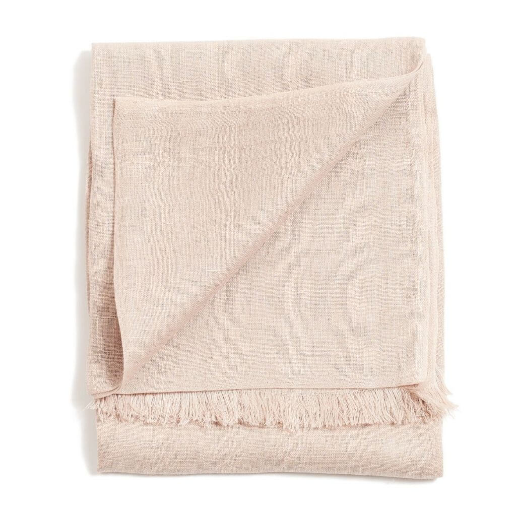 Soya Pastel Lime Green Hand Woven Soft Linen Scarf folded neatly showcasing its soft texture and fringe details.