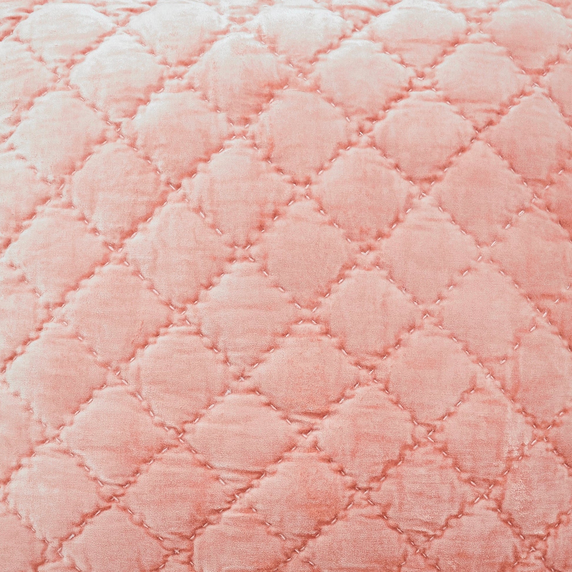QT-355-9496-LOT1A-LOT1_3|Close-up of a dusty pink velvet quilt, highlighting its distinct diamond quilted pattern with visible textural stitching.