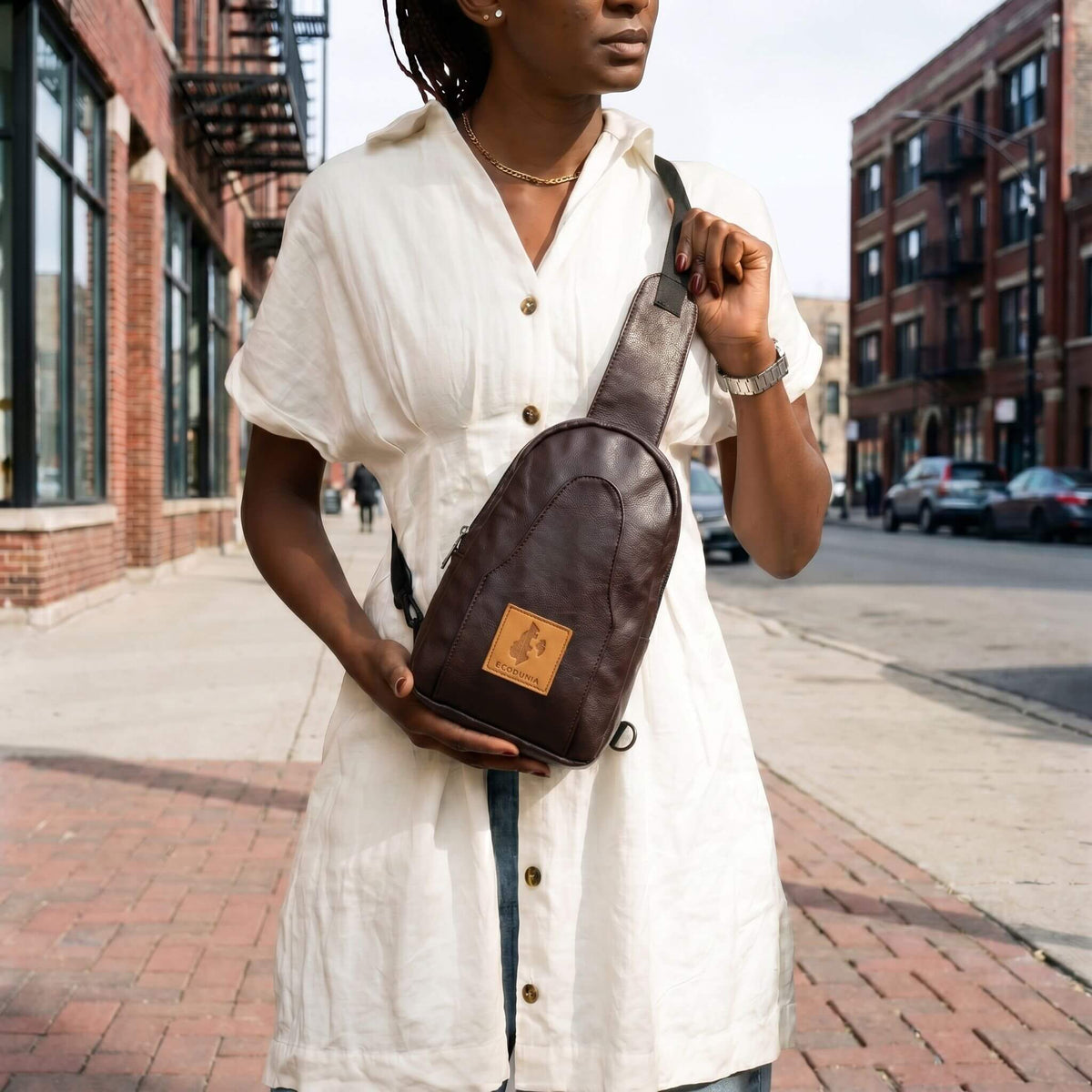 Buru plum vegan leather sling bag worn crossbody #color_plum
