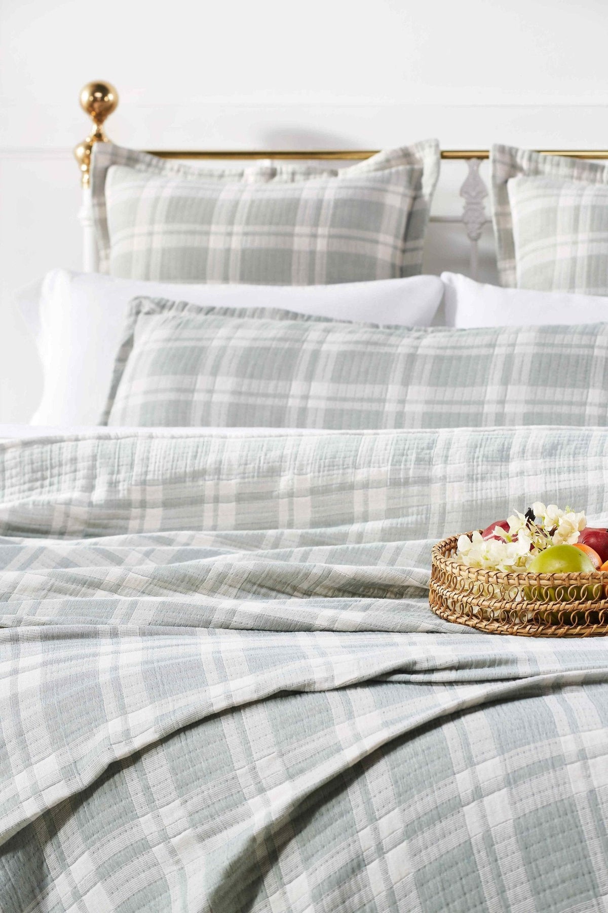 BT-119-9496_4|Sage green and white plaid quilted blanket draped on a bed with matching pillows, perfect for cozy bedroom decor.