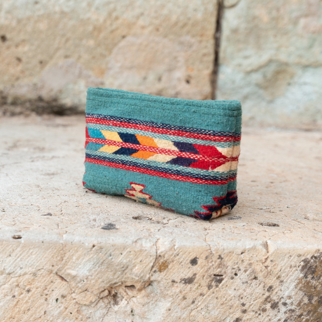 Handwoven pouch with abstract Zapotec arrow design in bold colors featuring internal pocket; perfect for makeup, wallet, or daily essentials.