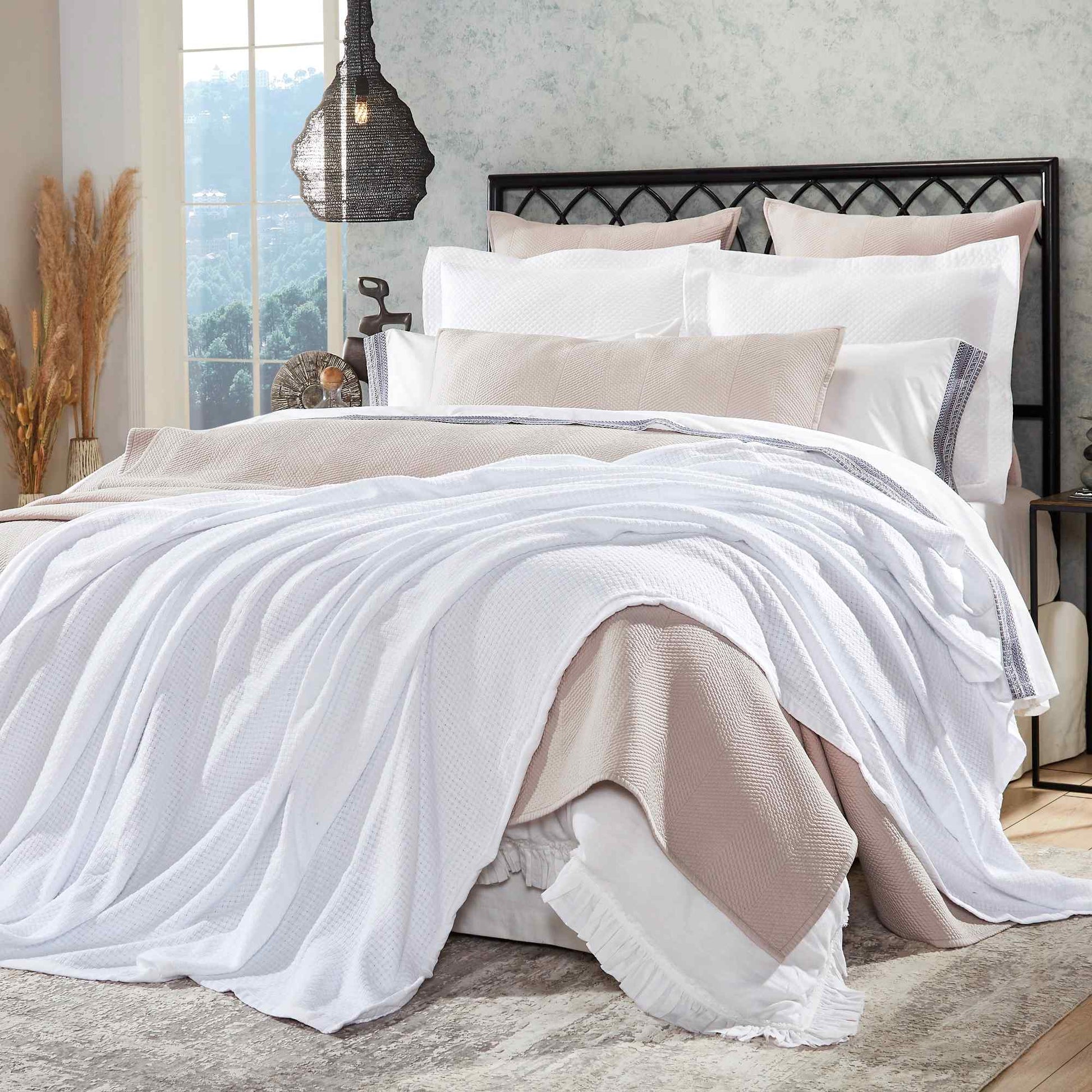 BL-851-11096_1|Draped white waffle weave blanket on a cozy bed with neutral bedding, adding a luxurious texture to bedroom decor.