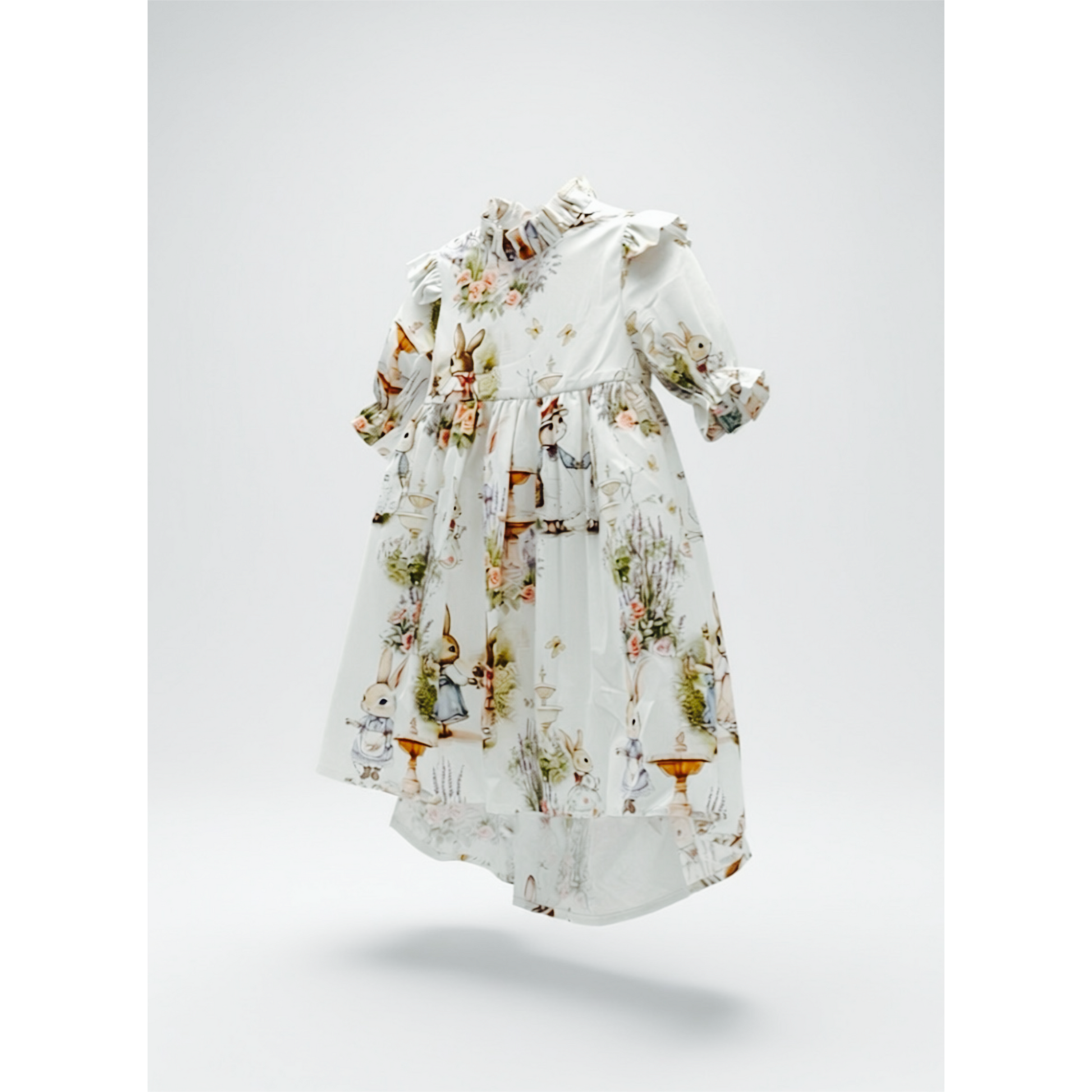 White Dress with a storybook Bramble Rabbit and floral pattern on a light gray background