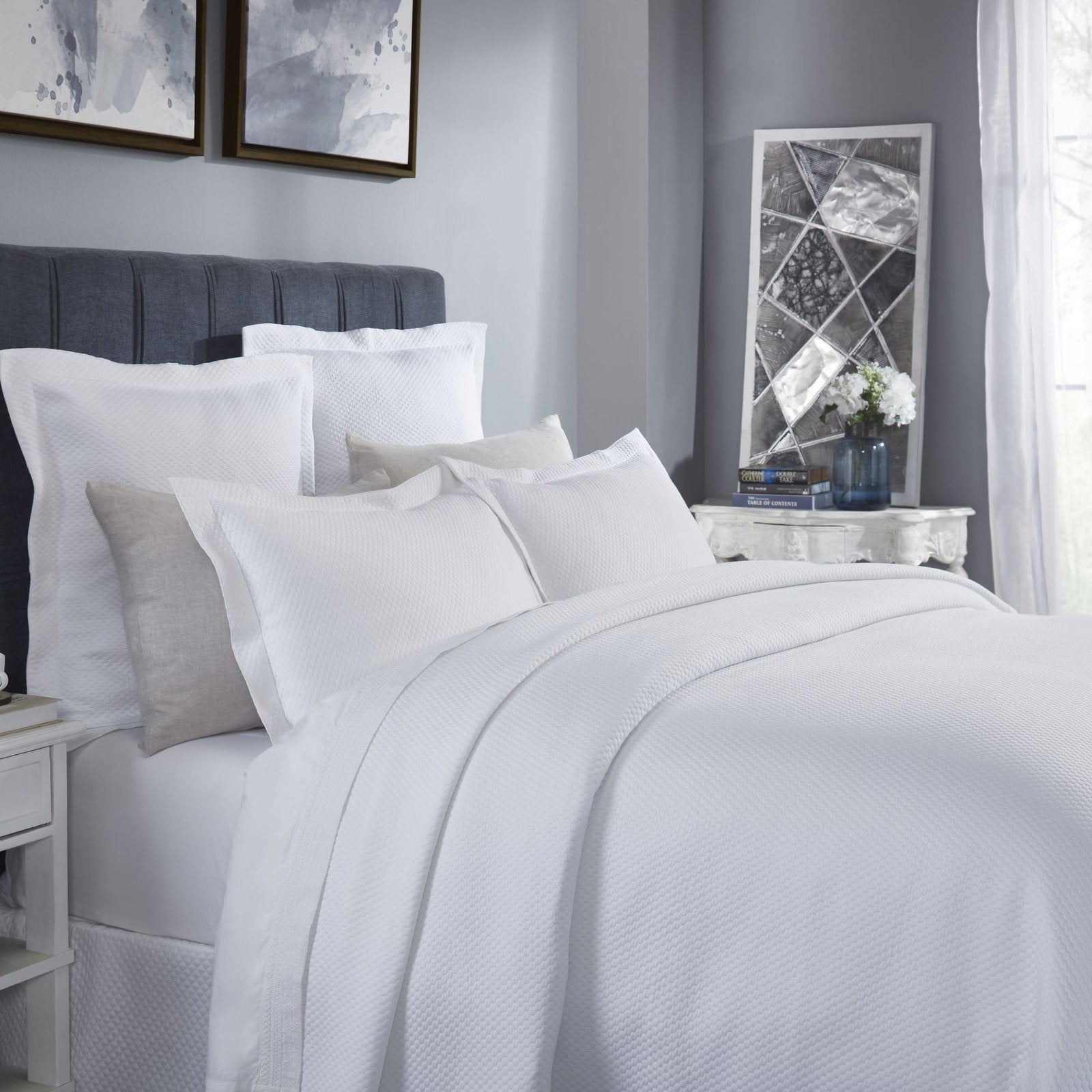 CL-256-11096_2|Crisp white textured coverlet with a modern waffle weave pattern, creating a clean and inviting bedroom aesthetic.