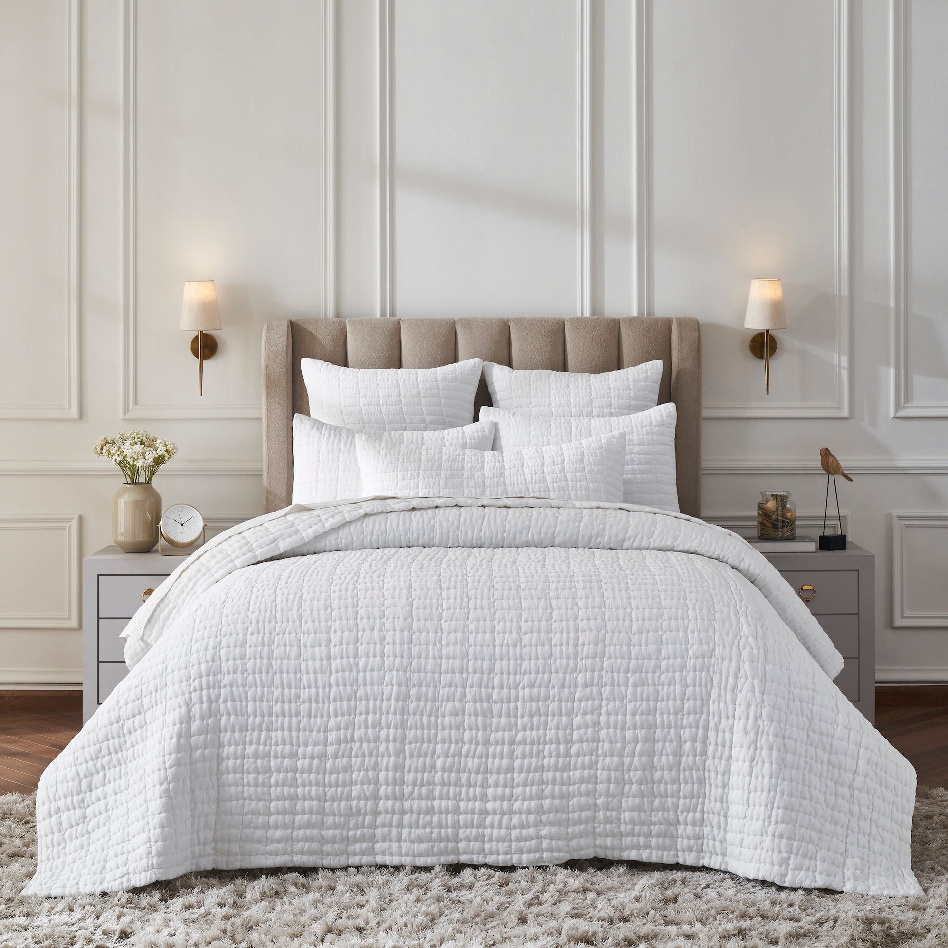 QT-372-11096_1|Elegant white textured quilt set adorns a serene bedroom, offering luxurious comfort and a clean, modern aesthetic.