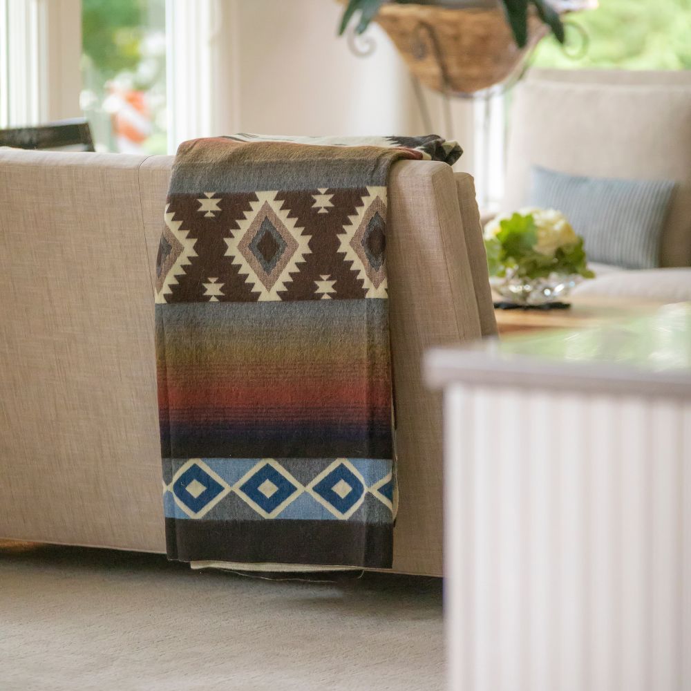 handwoven throw with white geometric design
