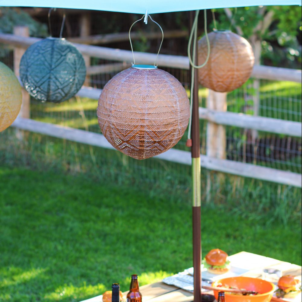 Soji Stella Market 12" Tyvek Solar Lanterns under umbrella