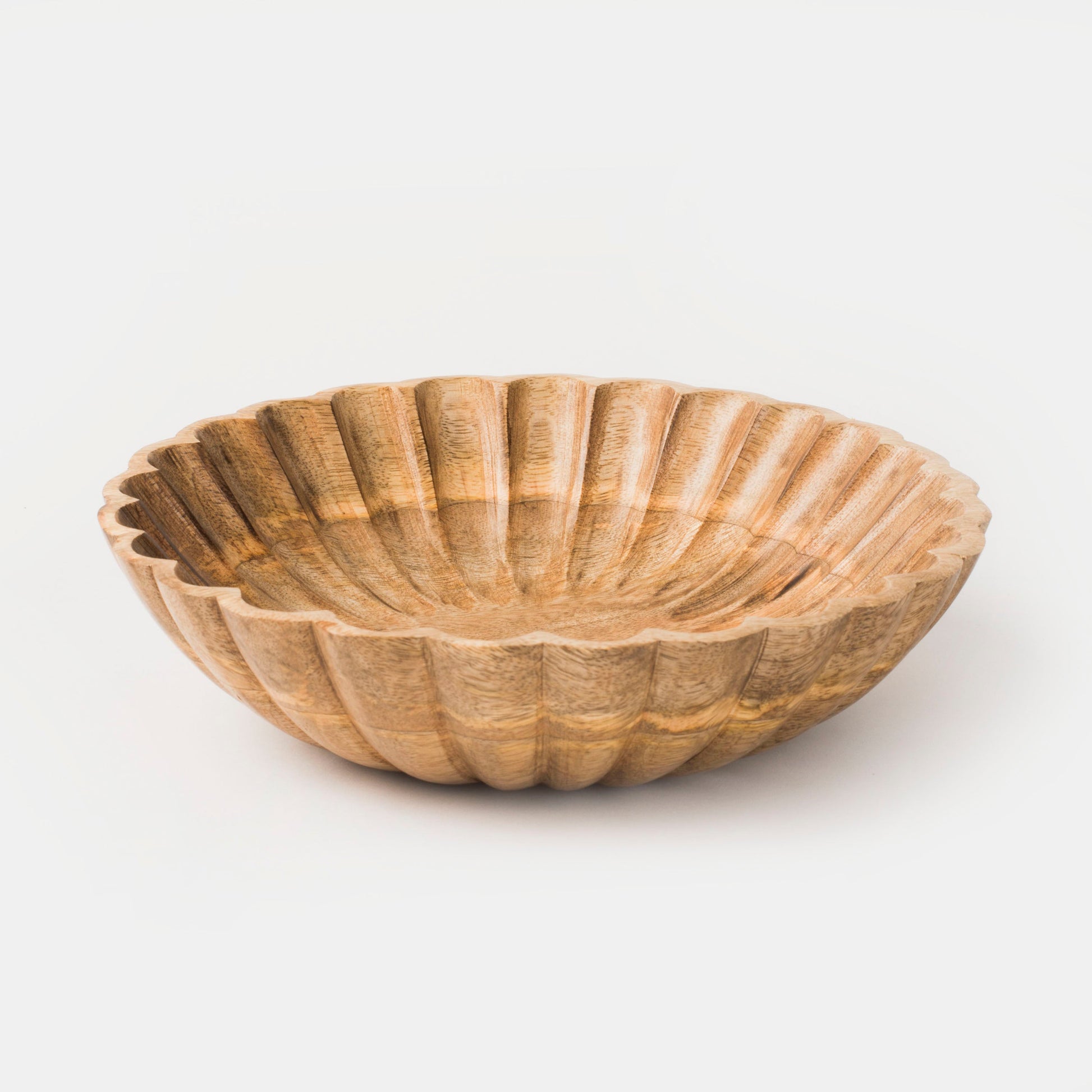 Close-up of carved scalloped pattern and natural wood grain