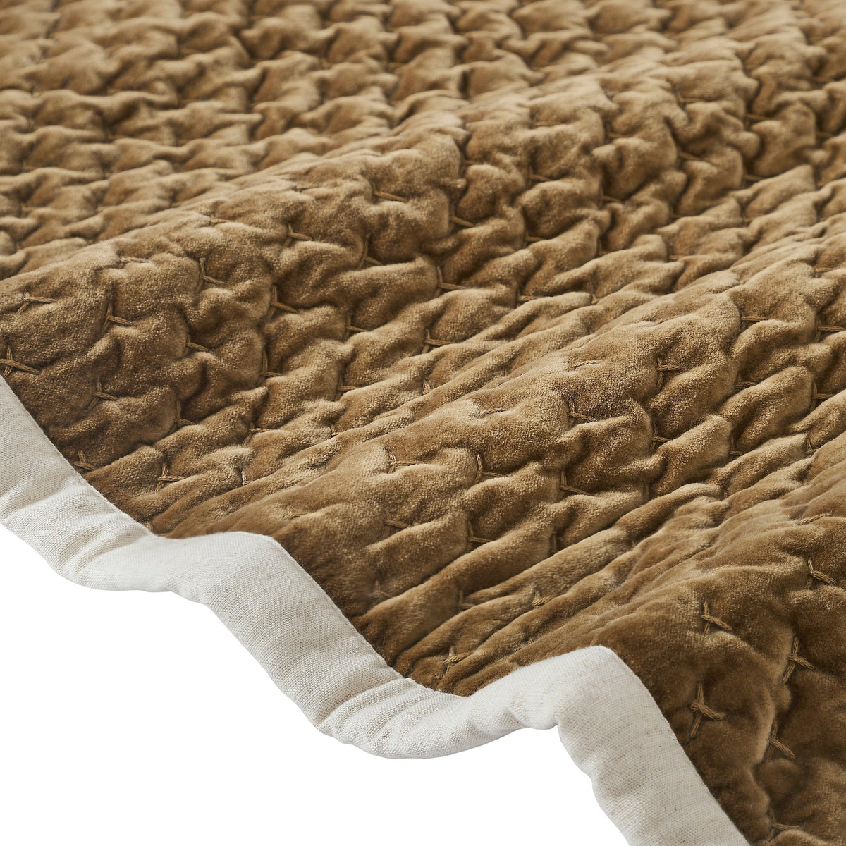 QT-378-9496_8|Close-up of the golden brown quilted velvet bedspread's edge with a crisp white border, emphasizing rich texture.