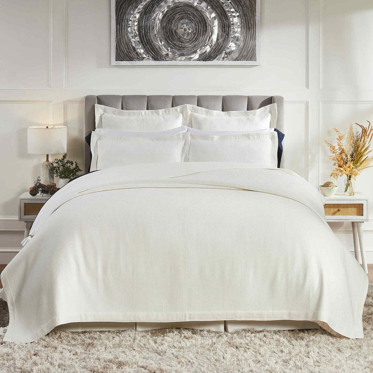 CL-192-11096_1|Modern white striped coverlet on a luxurious bed, providing a cozy and stylish foundation for any bedroom decor.