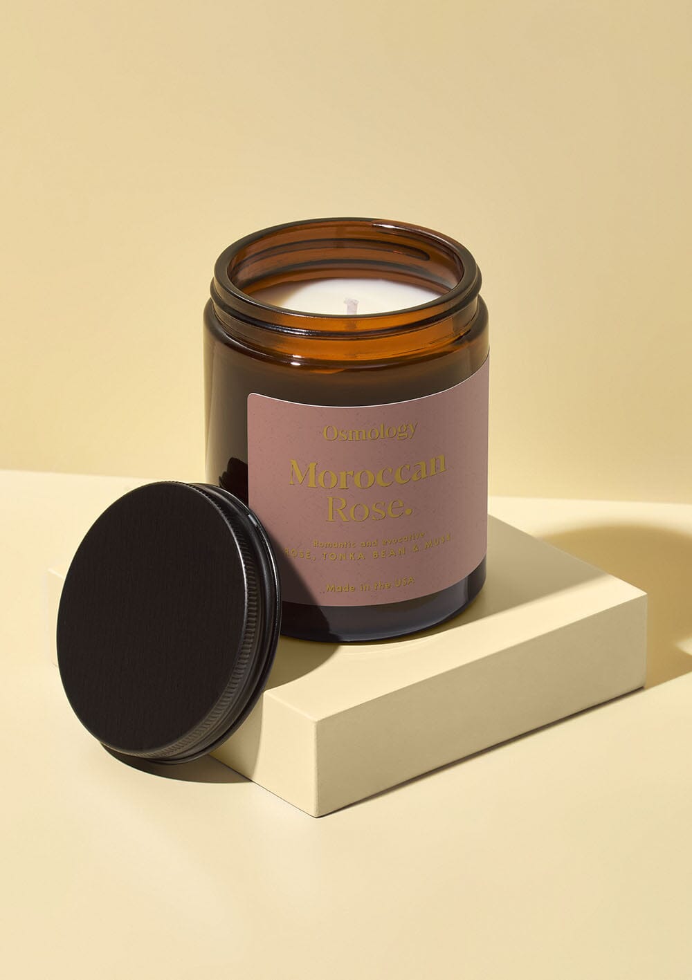 Osmology Moroccan Rose jar candle with open lid on white background