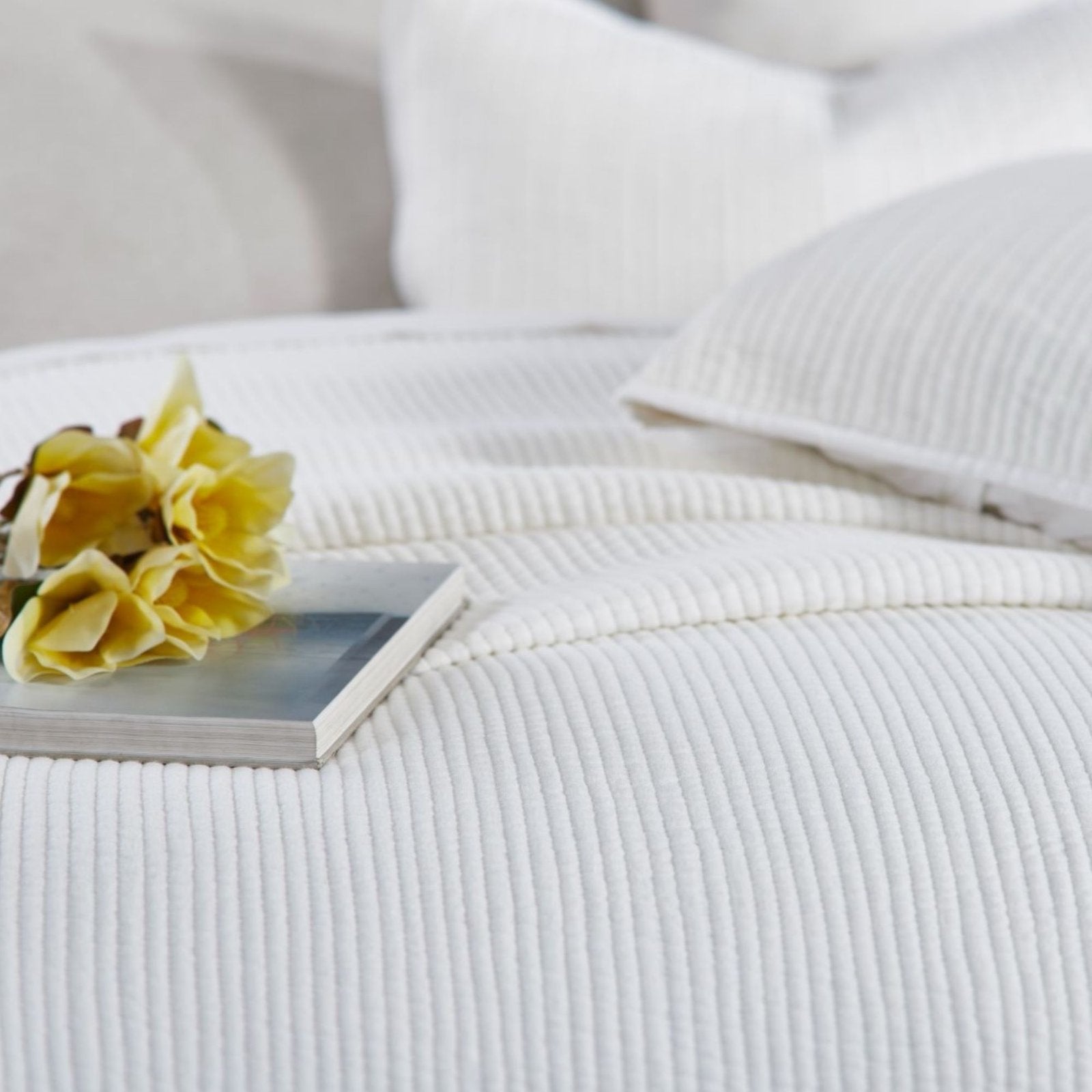 CL-196-11096_7|Detailed view of a cozy white channel stitch quilted coverlet, highlighting its inviting texture for a relaxing bedroom.
