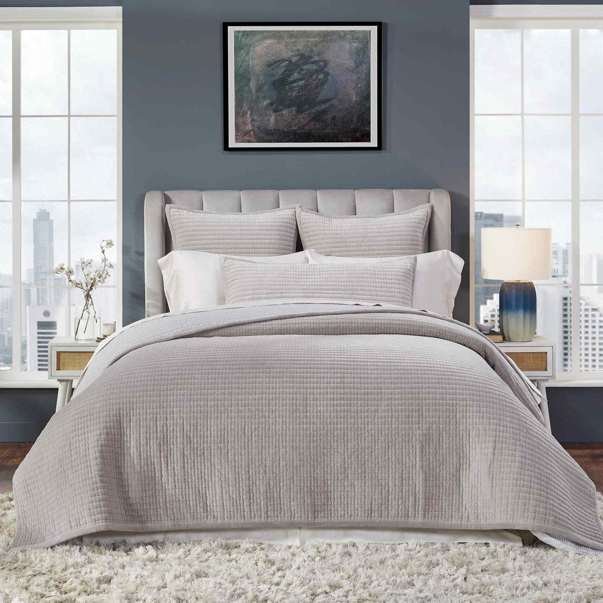 CL-188-11096_3|Modern bedroom with a soft grey quilted coverlet on the bed, showcasing a structured channel quilt design.