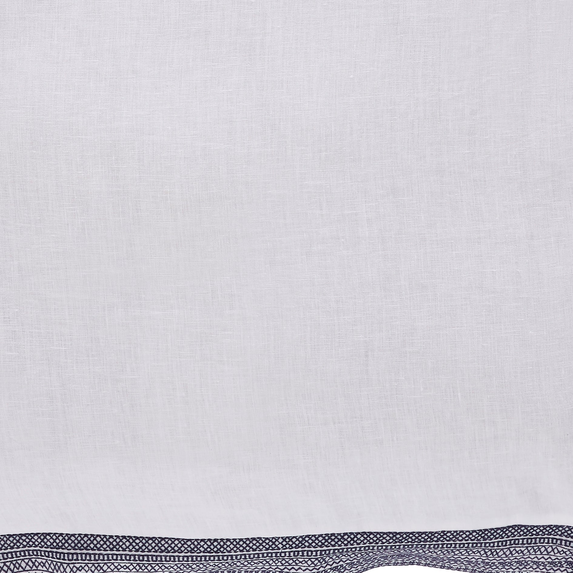 DT-016-10692_5|Close-up of a soft white linen duvet cover with a stylish navy blue geometric pattern border detail.
