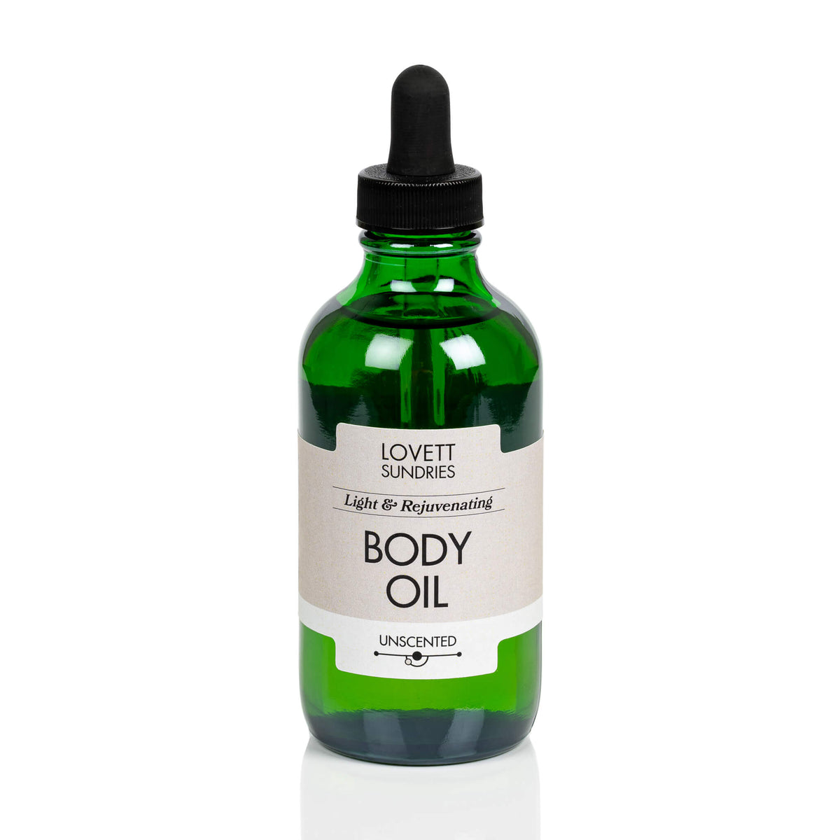 Green bottle of Lovett Sundries Organic Body Oil on a white background.