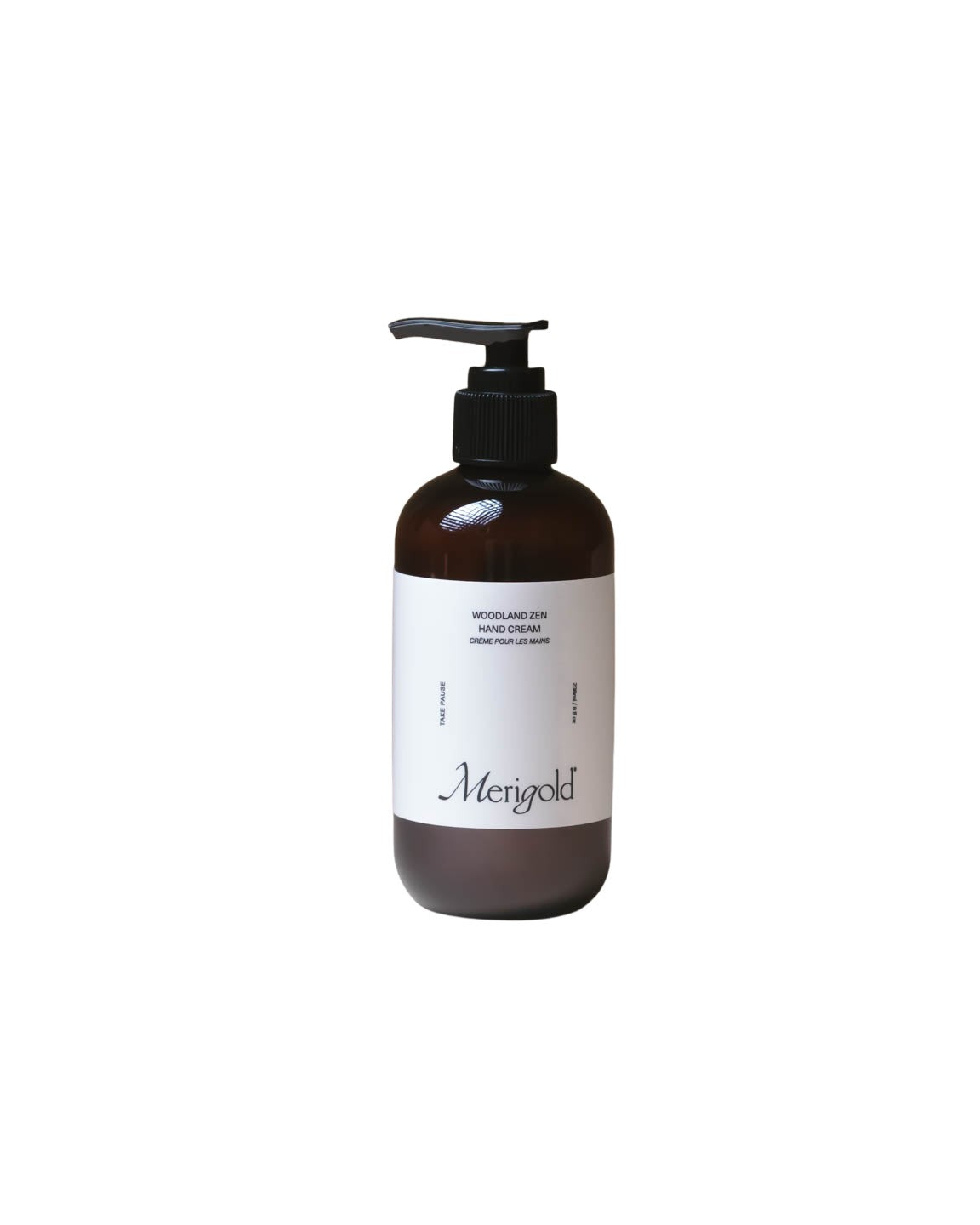 Merigold Woodland Zen Hand Cream in amber jar on neutral backdrop, grounding botanical hand cream with soft white texture.