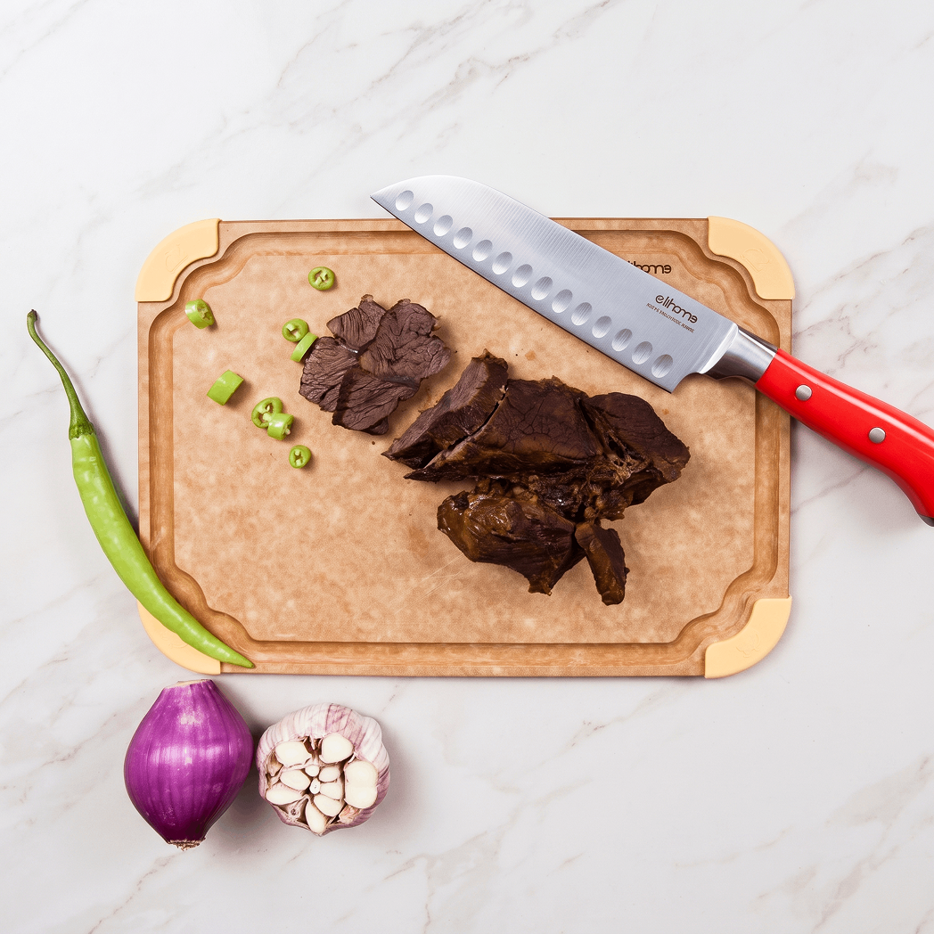 Cooked food served on Elihome Premium Series Medium Cutting Board with yellow non-slip corners