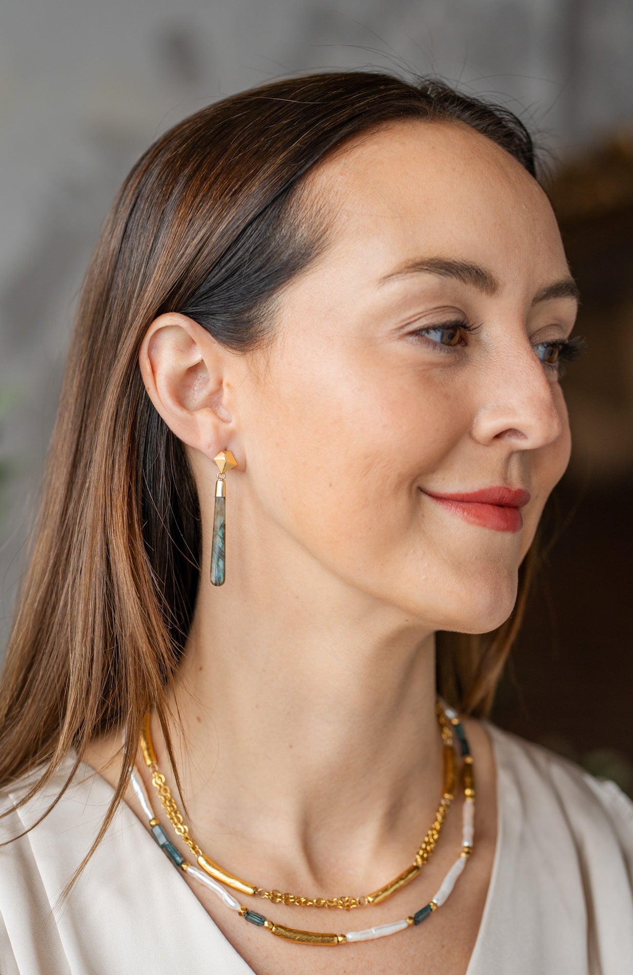 Gold-plated necklace with textured tube beads spaced along a double 