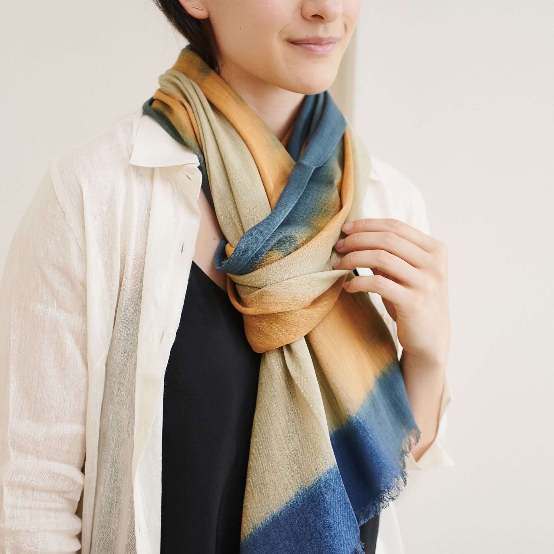 Oceana Beige Soft Linen Silk Handloom Scarf styled with an ombre effect, worn by a model.