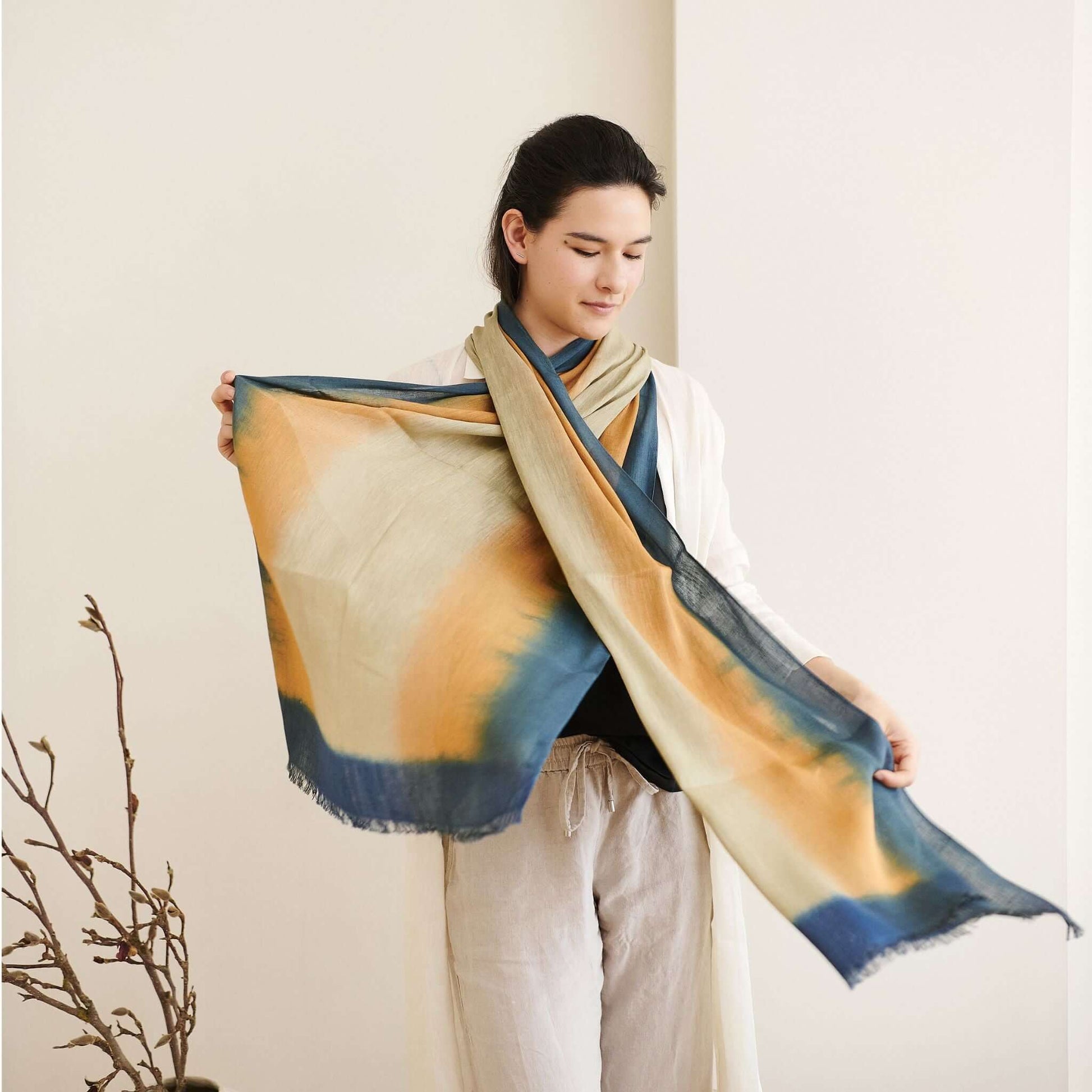 Oceana Beige Soft Linen Silk Handloom Scarf worn by a model, showcasing its ombre design and soft texture.