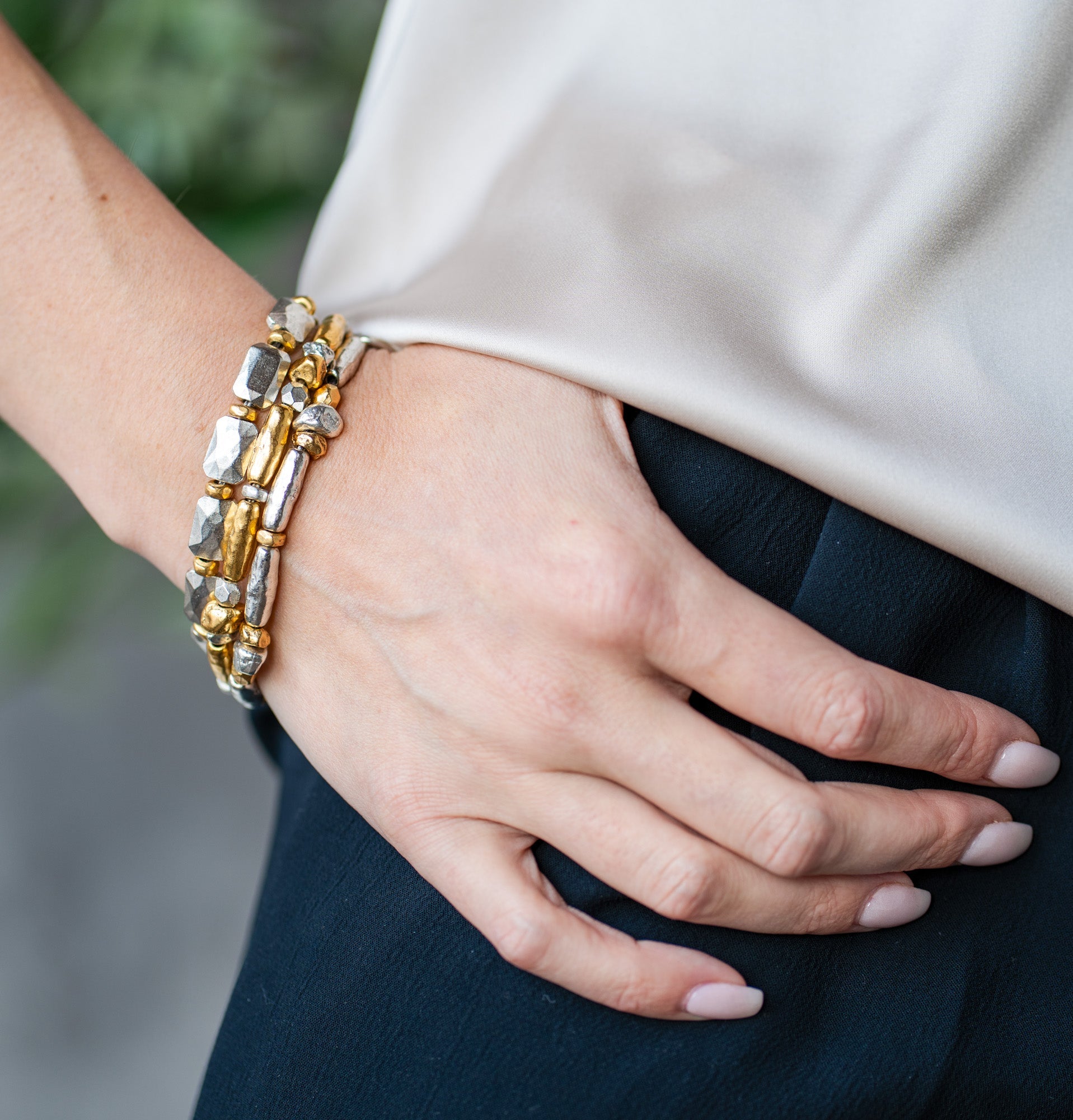 Bracelet with silver faceted rectangular beads and gold spacers, finished with a toggle clasp.