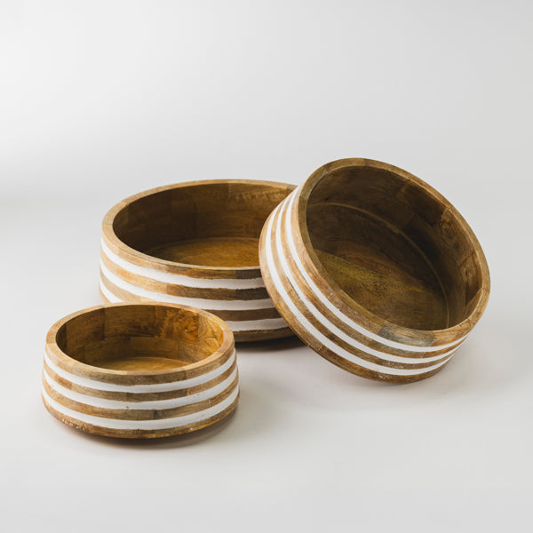 Three Whitehaven striped wooden bowls displayed separately to show size variety for serving.