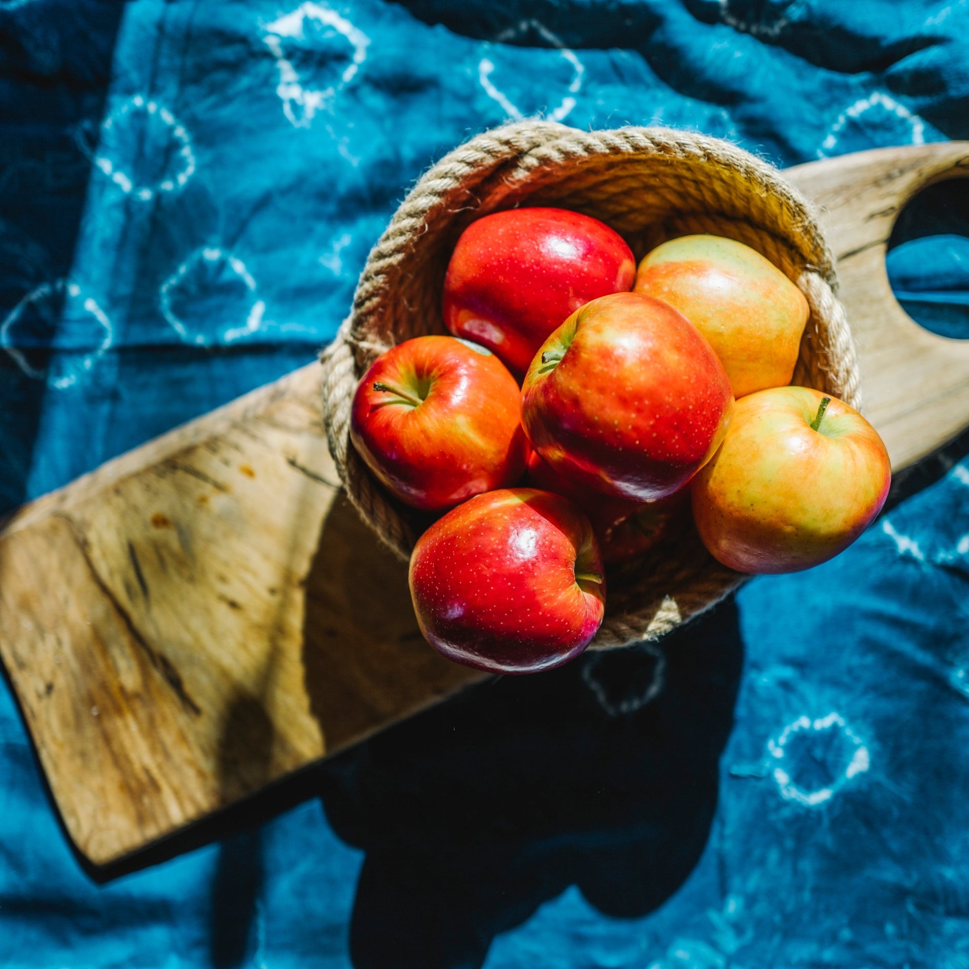 A photo of apples in a handcrafted bowl, jute bowl, Starfish Project, quality brands