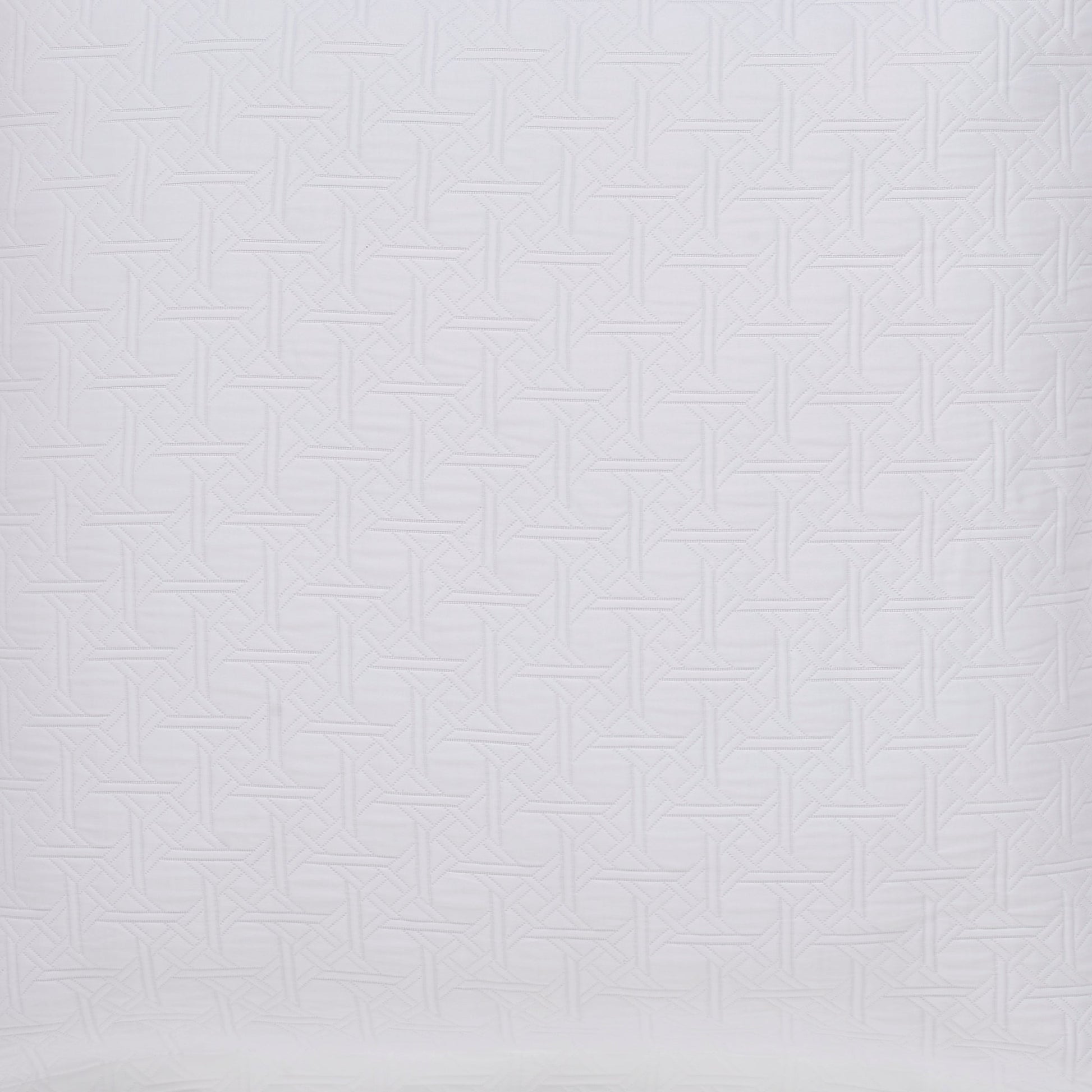 ES-175-2626_2|Detail of white geometric quilted coverlet. Elegant, intricate bedding for a stylish and contemporary bedroom look.