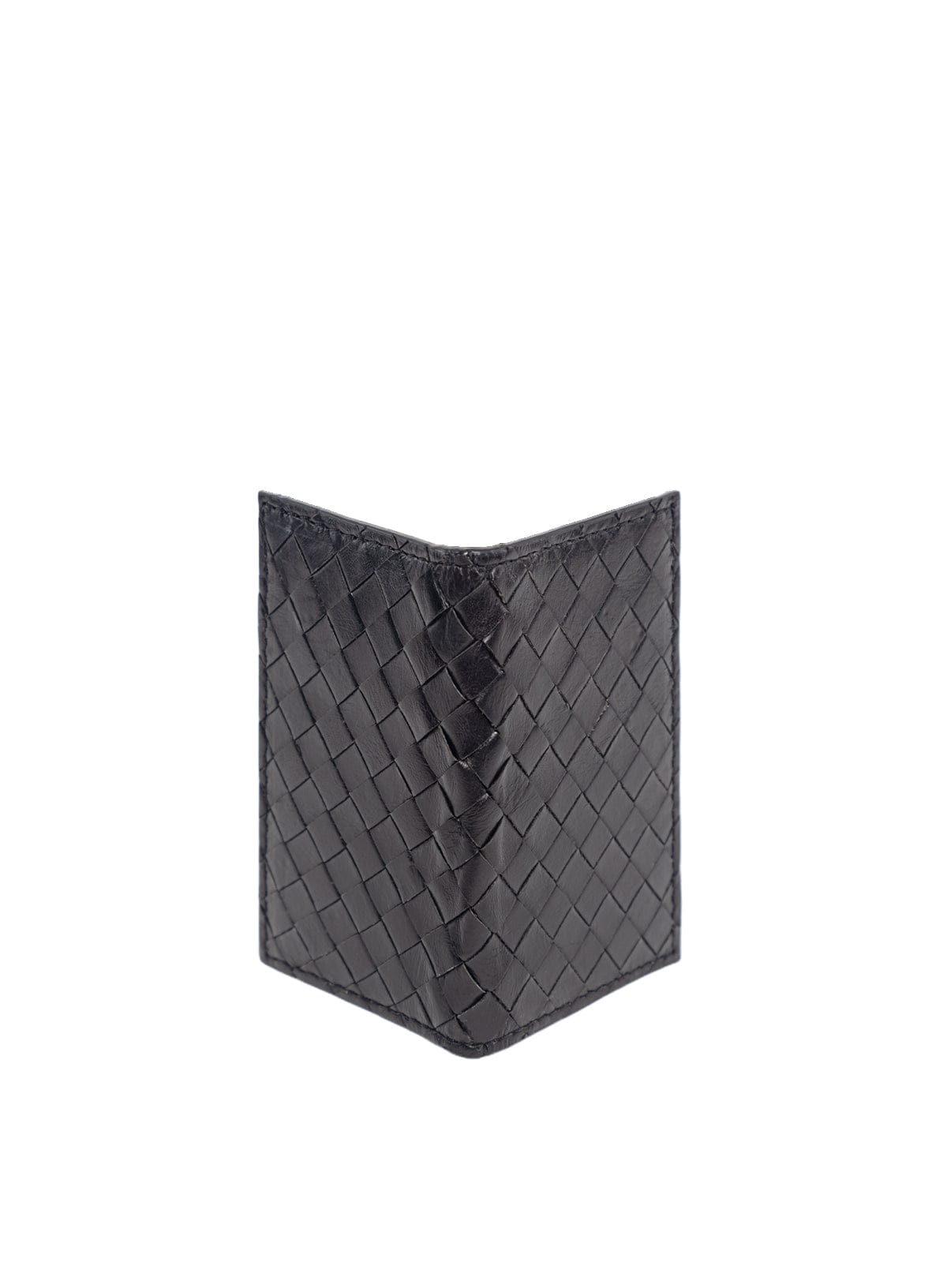 Woven card holder in black and mahogany held by model sitting down.