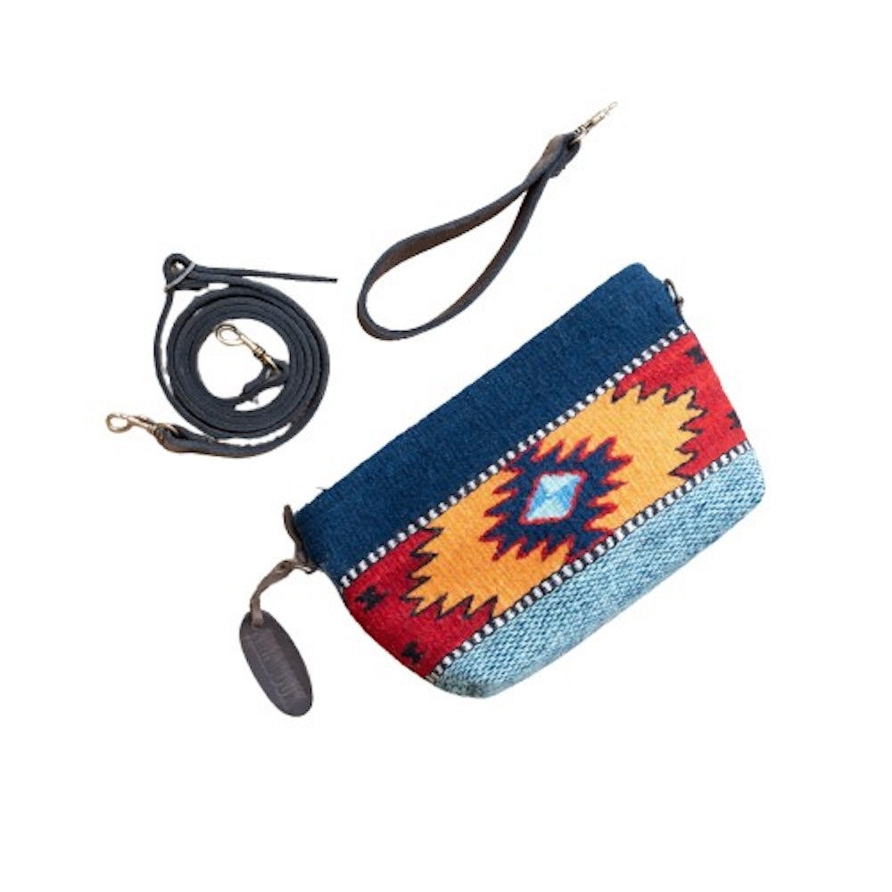 Handwoven convertible clutch with Zapotec pattern in bold colors; can be used as a pouch, wristlet, or crossbody with included leather straps and internal pocket.