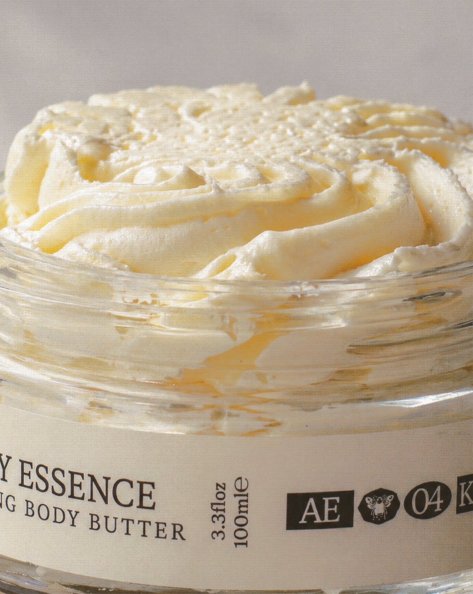 Apiary Essence body butter texture in open jar